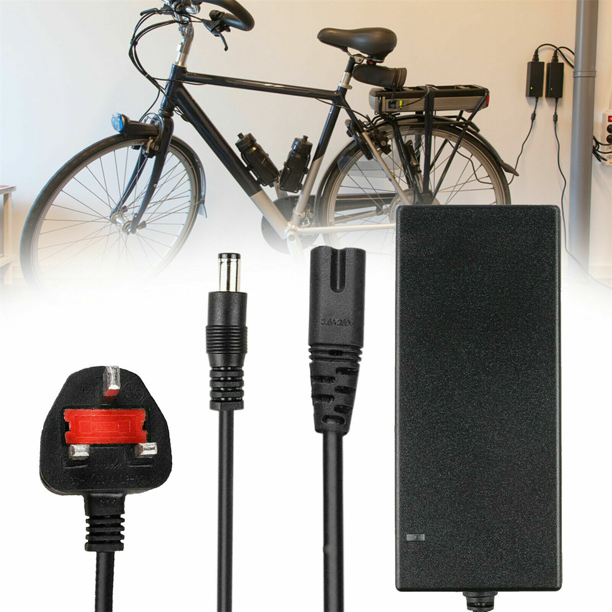 E-Bike mit Kabeln, Ladegerät und Stecker. Fahrrad an weißer Wand.