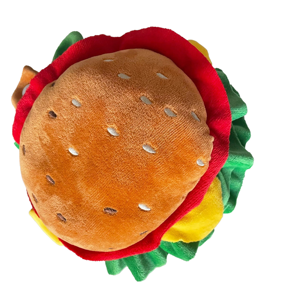 Ein Plüsch-Burger-Spielzeug mit braunem Patty, rotem Brötchen, gelbem Käse und grünem Salat, weißer Hintergrund.