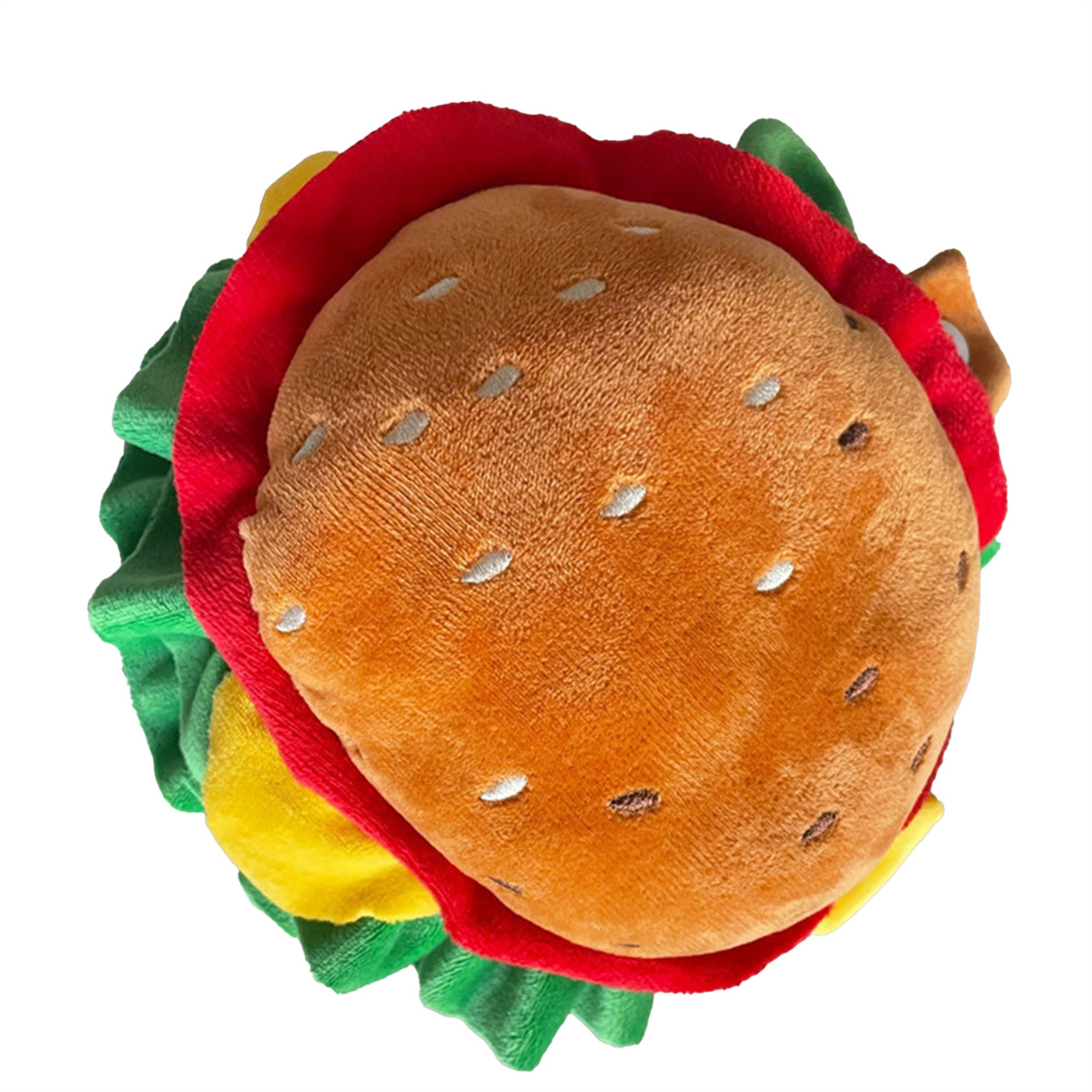 Draufsicht auf ein Plüsch-Burger-Spielzeug. Es hat orangefarbenes Brötchen, roten Salat, gelben Käse, und weißen Hintergrund.