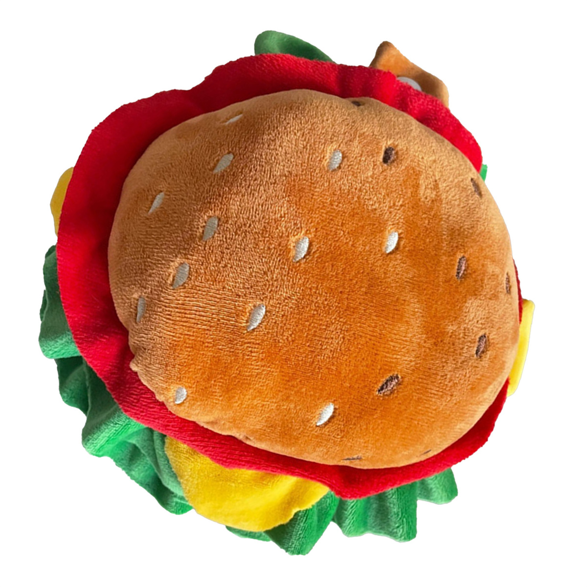 Ein Plüsch-Hamburger-Spielzeug, Draufsicht. Brötchen, Salat, Tomate, Käse und ein Burger.