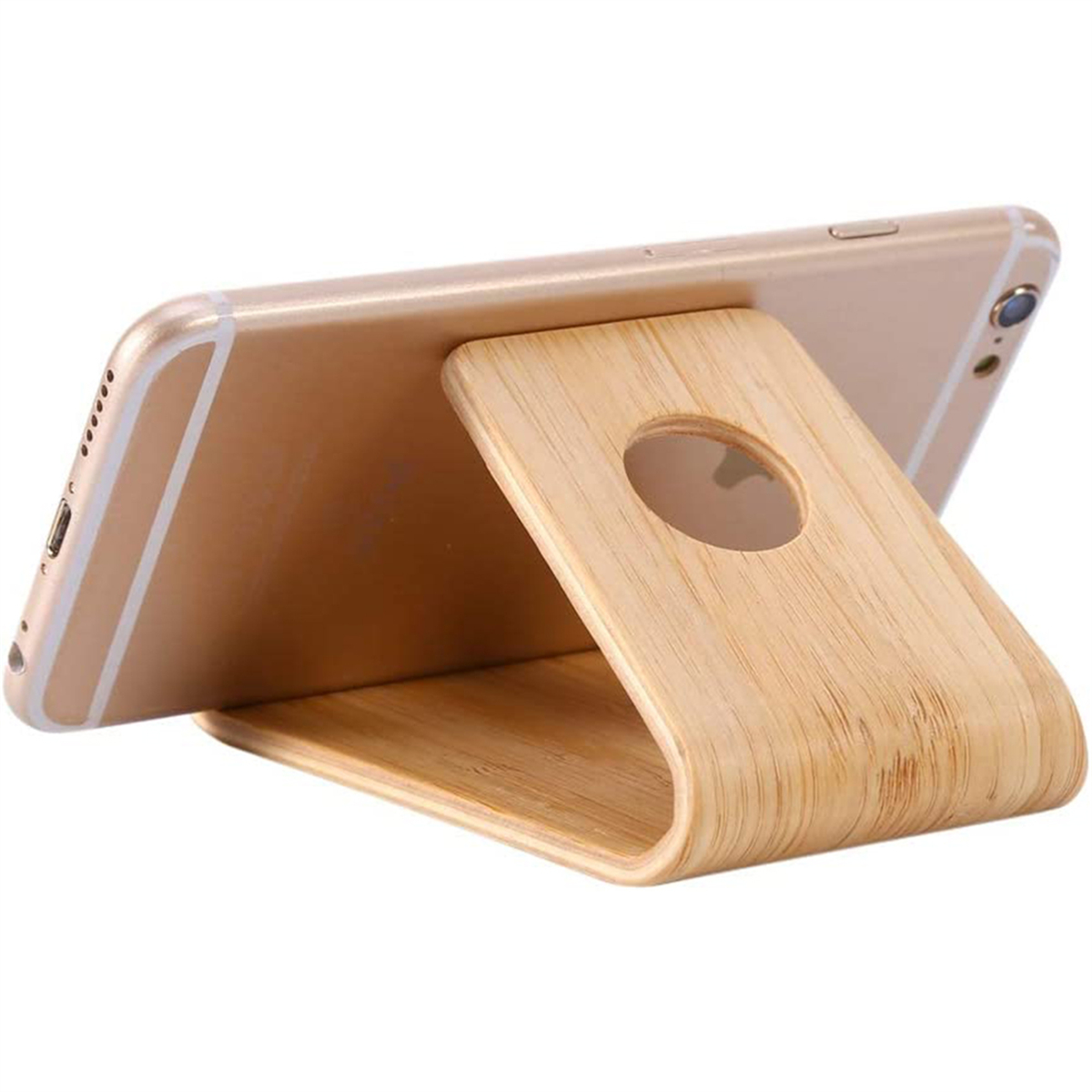 Ein Smartphone ruht auf einem Holzständer. Das Telefon ist goldfarben, der Ständer ist aus Holz, in Seitenansicht.
