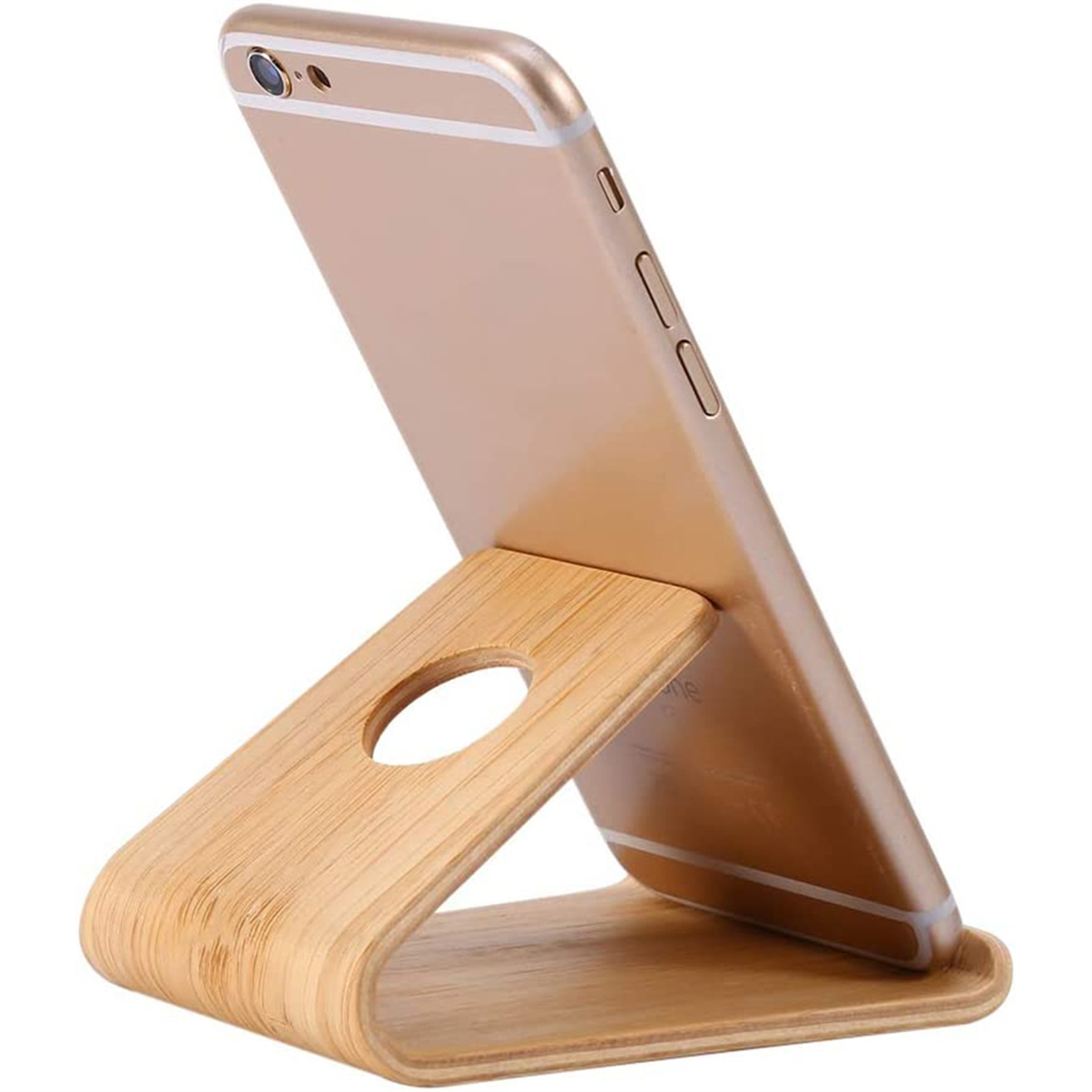 Telefonständer aus Holz. Goldfarbenes Telefon im Ständer, schräge Ansicht. Hellbraunes Holz.
