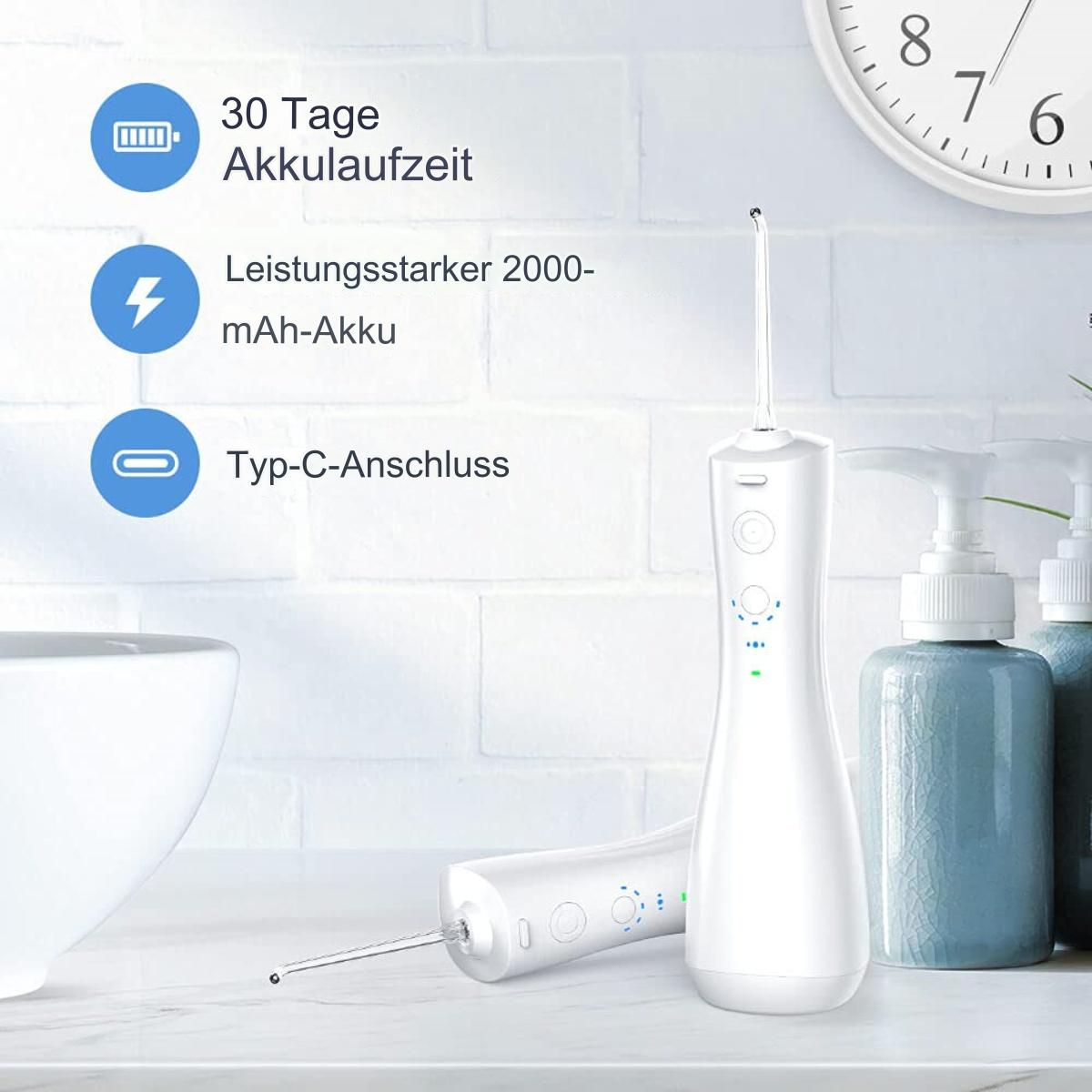 Ein weißer Wasser-Flosser und ein weiterer daneben in einem Badezimmer mit Uhr und Seife.