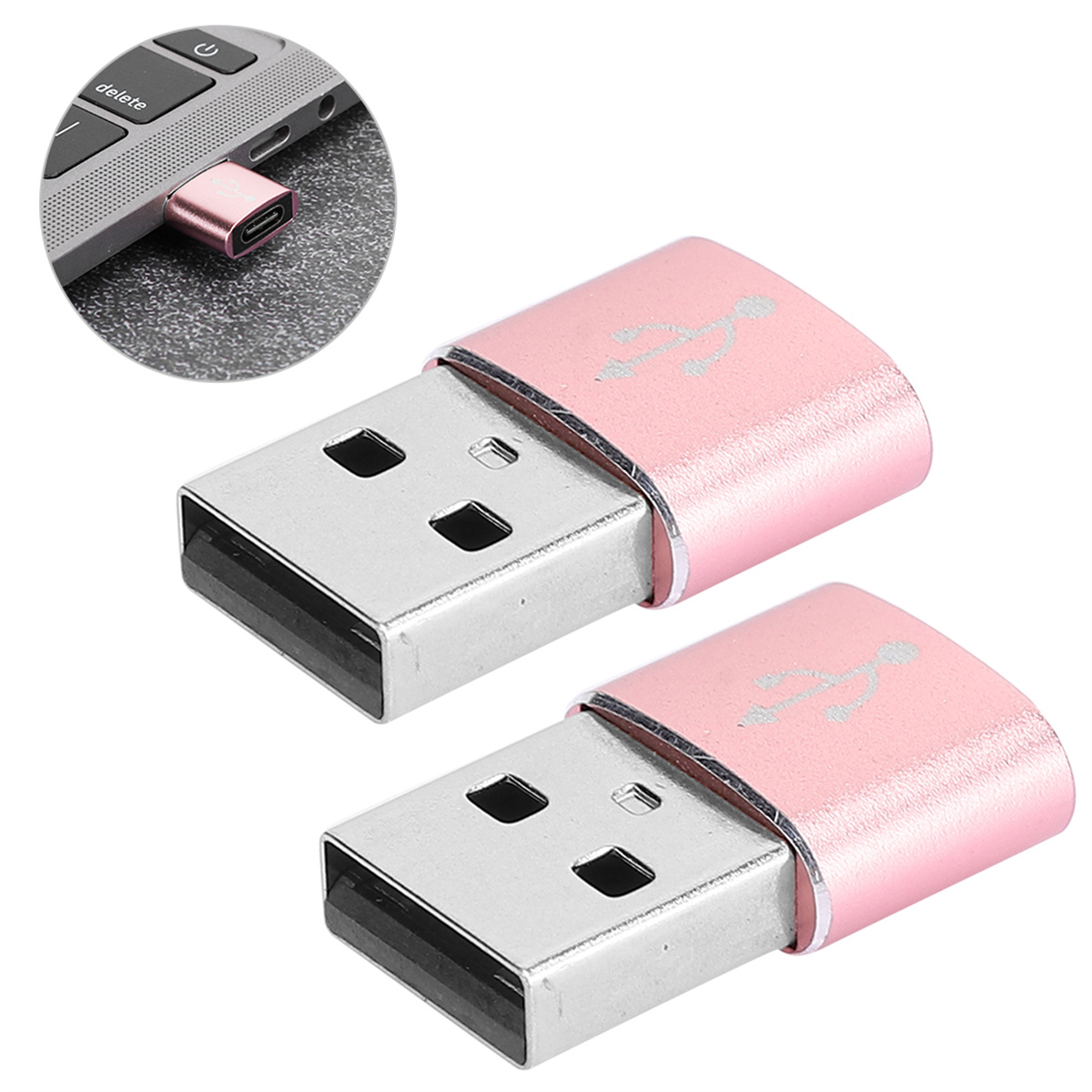 Zwei rosa USB-Laufwerke werden in einen Laptop eingesteckt gezeigt.