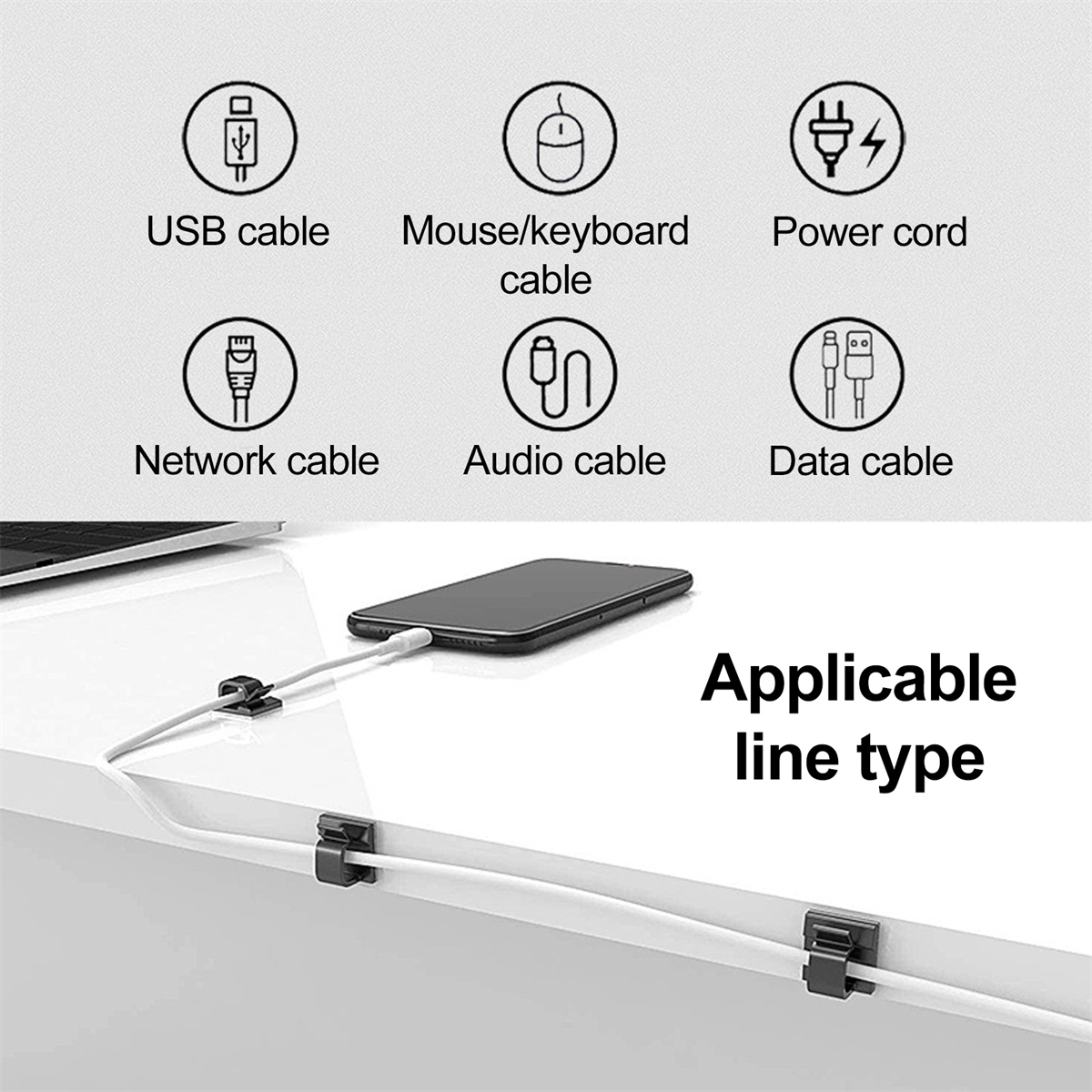 Mehrere Kabel und ein Telefon auf einem weißen Schreibtisch. Zu den Kabeln gehören USB-, Maus-/Tastatur-, Netzkabel, Netzwerk-, Audio- und Datenkabel.