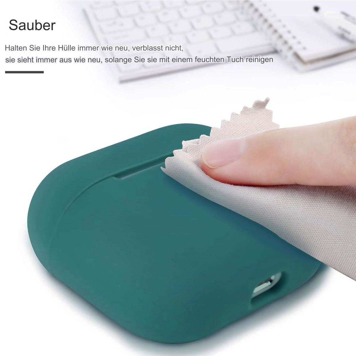 Eine Hand reinigt ein tealfarbenes Gehäuse mit einem Tuch. Im Hintergrund ist eine Tastatur sichtbar.