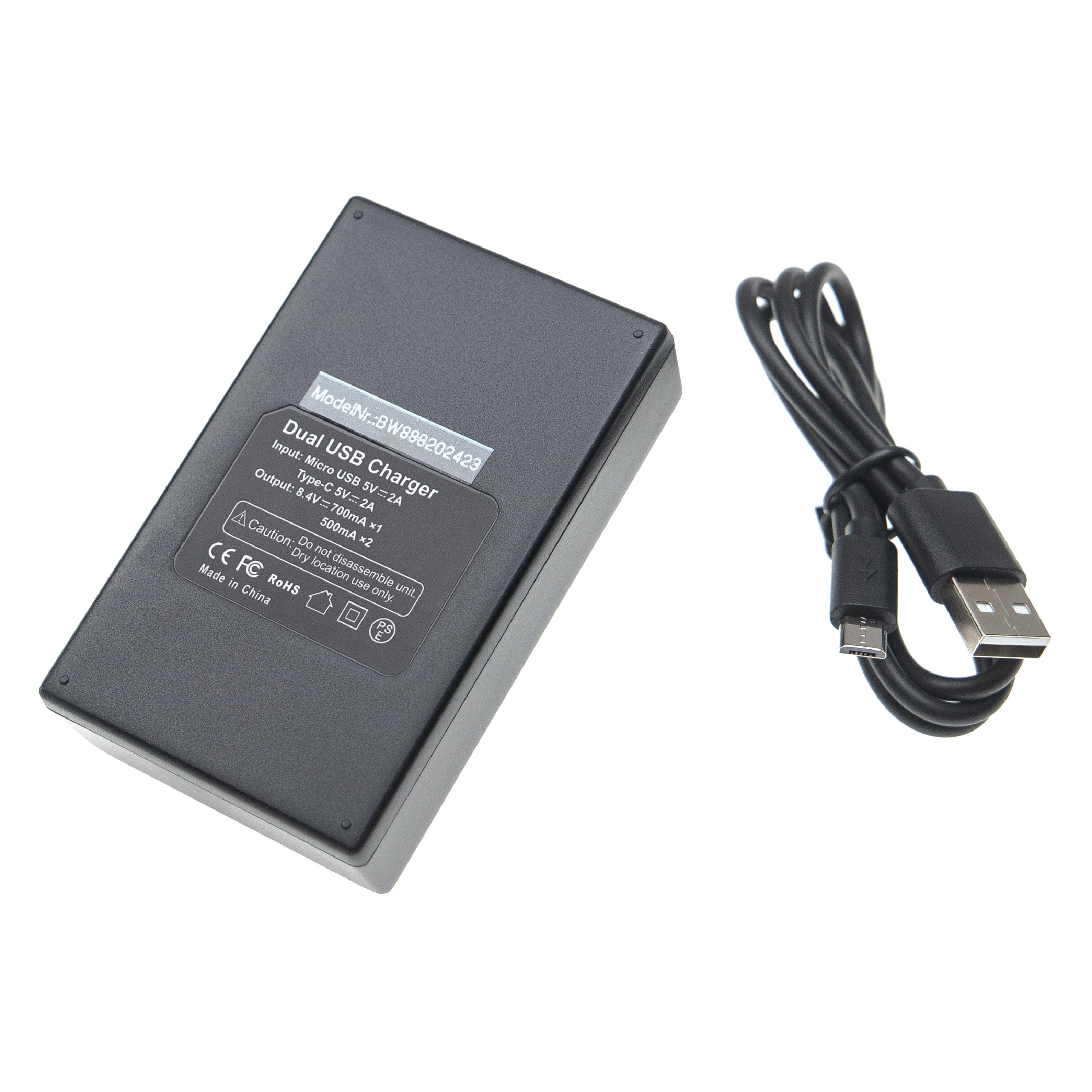 Schwarzes Dual-USB-Ladegerät mit einem USB-Kabel. Das Gerät hat ein Etikett mit Eingangs- und Ausgangsspezifikationen.