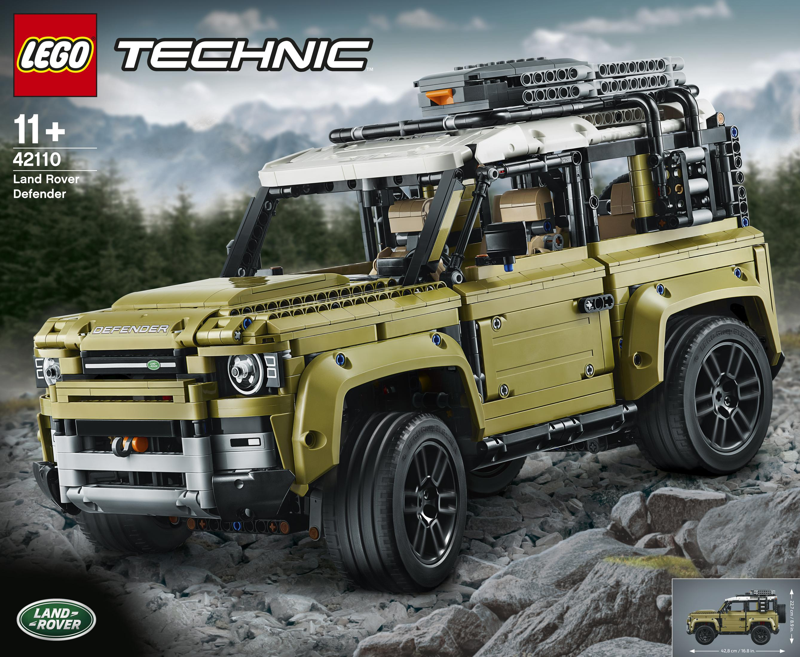 Model Lego Technic Land Rover Defender, oliwkowy, na skalistej powierzchni.