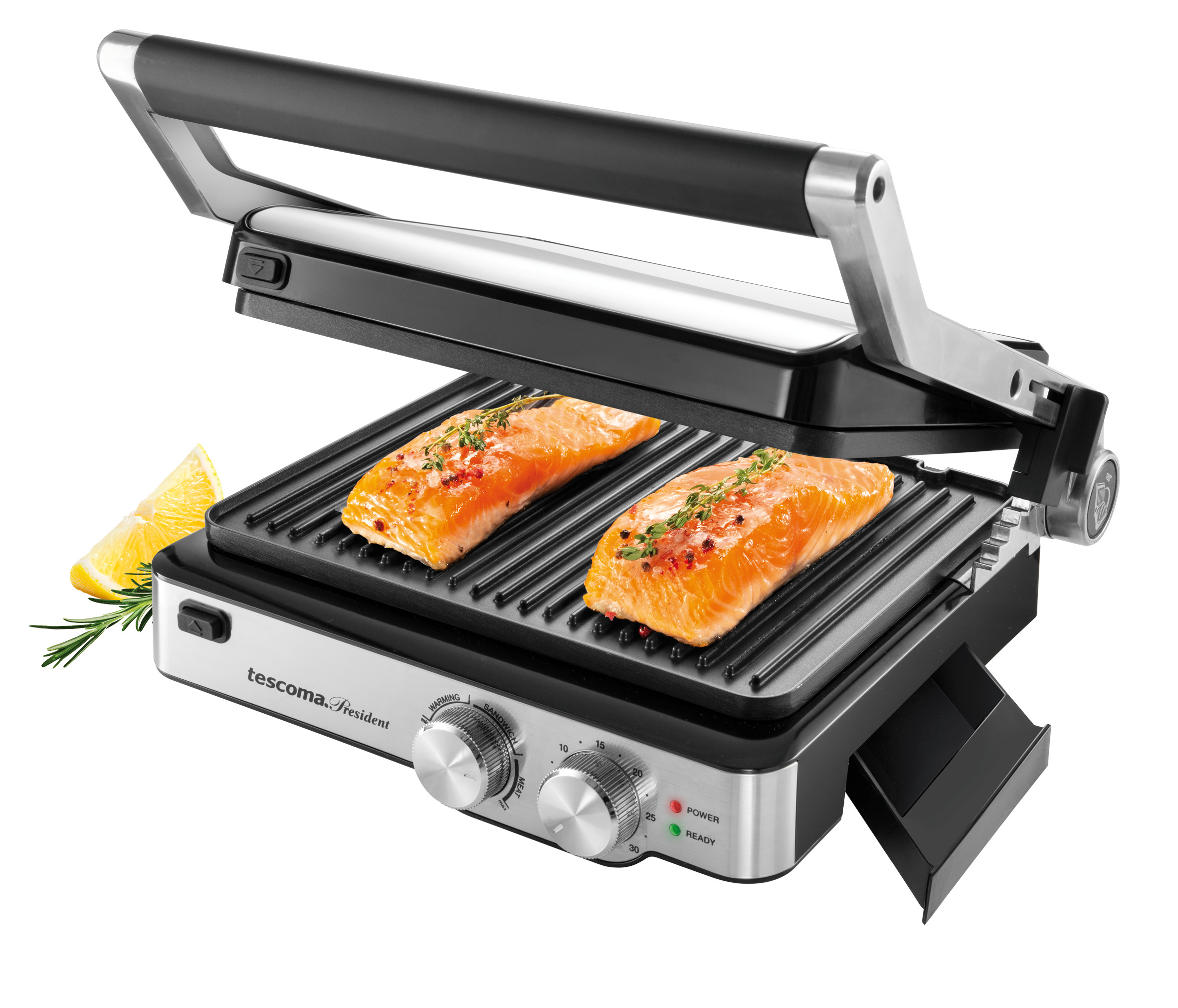 Ein Grill mit zwei Lachsfilets, Zitrone und Kräutern. Der Grill ist geöffnet.