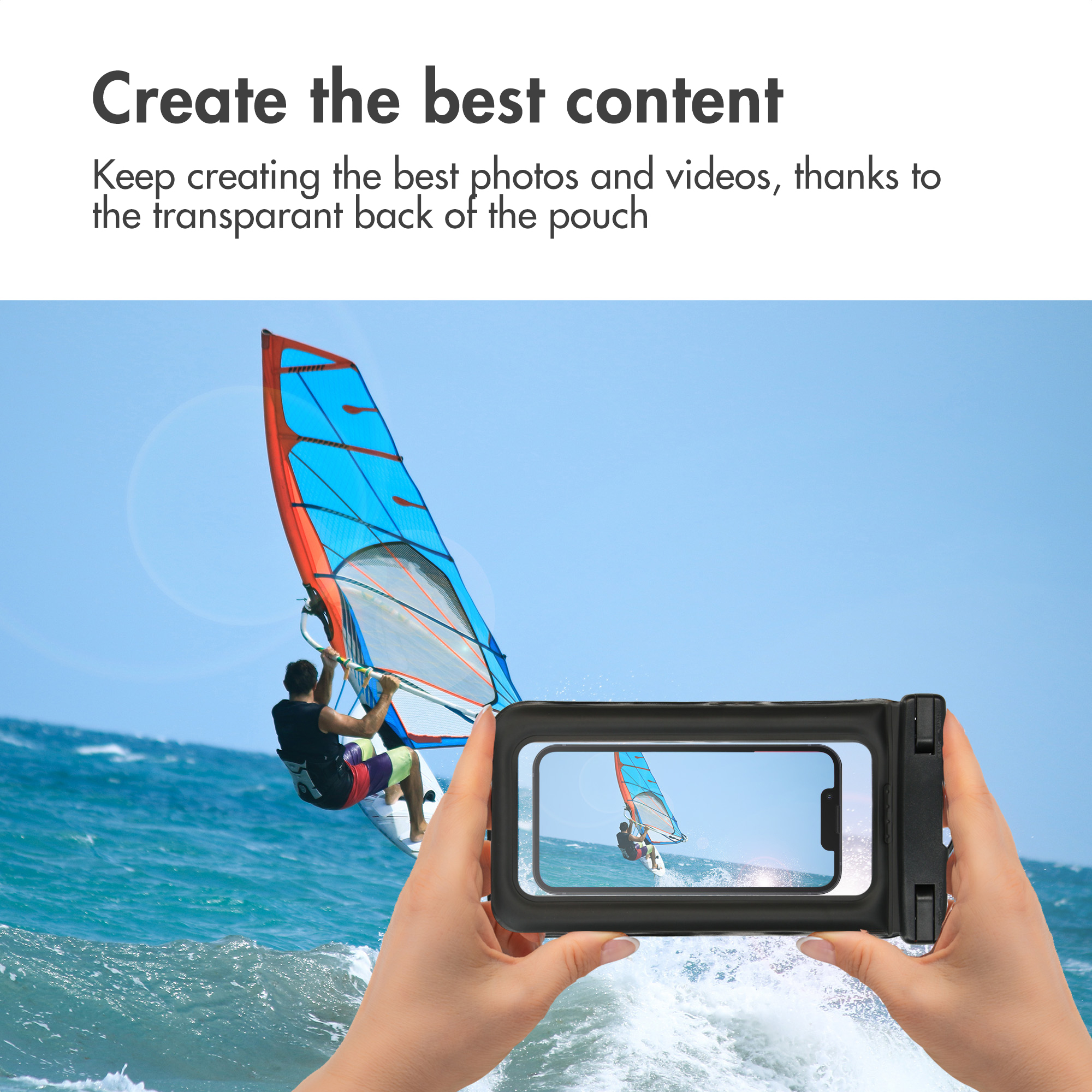 Hands holding a phone in a waterproof case, taking a photo of a windsurfer on the water.