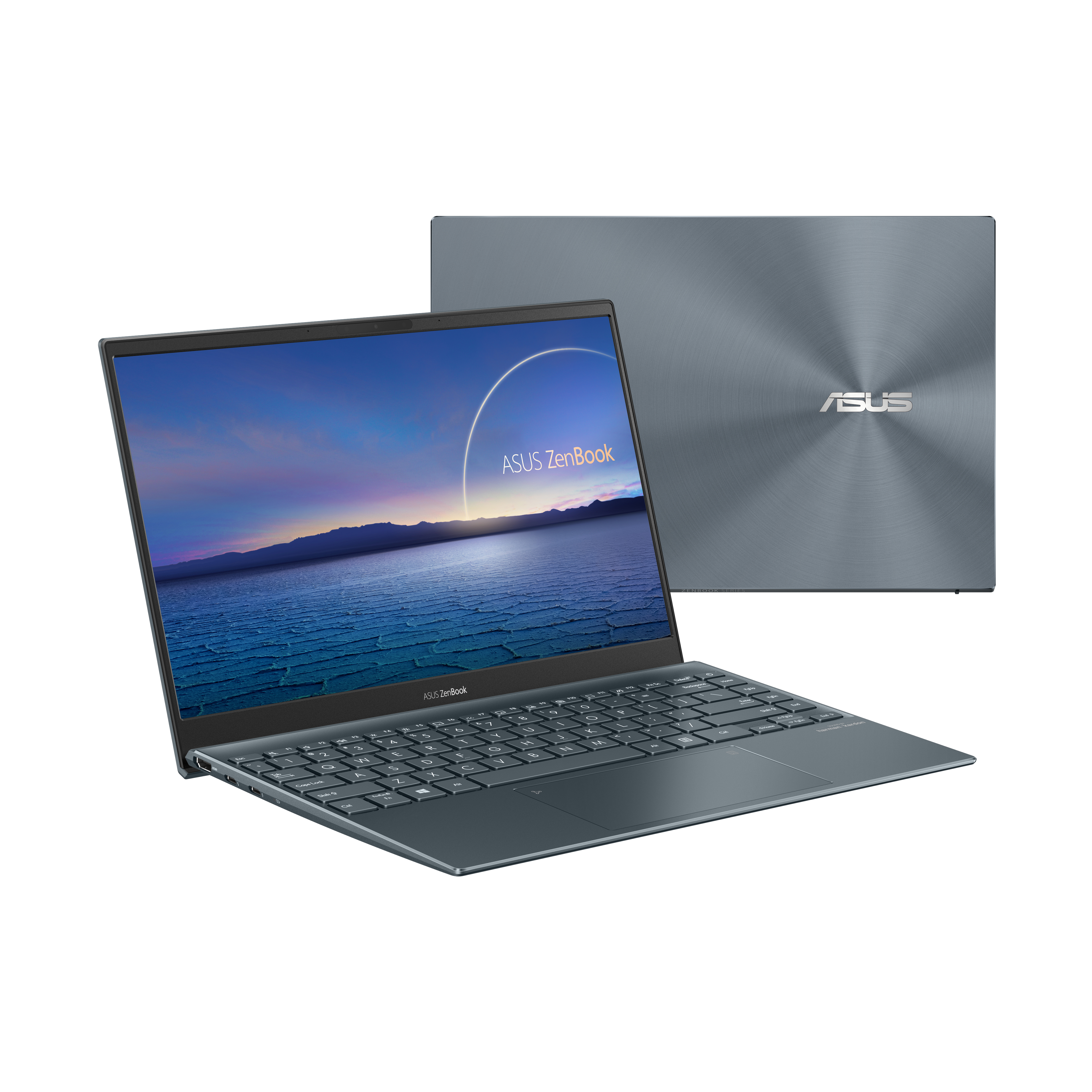 Laptop Asus Zenbook. Chiuso, corpo blu, tastiera visibile. Sfondo bianco.