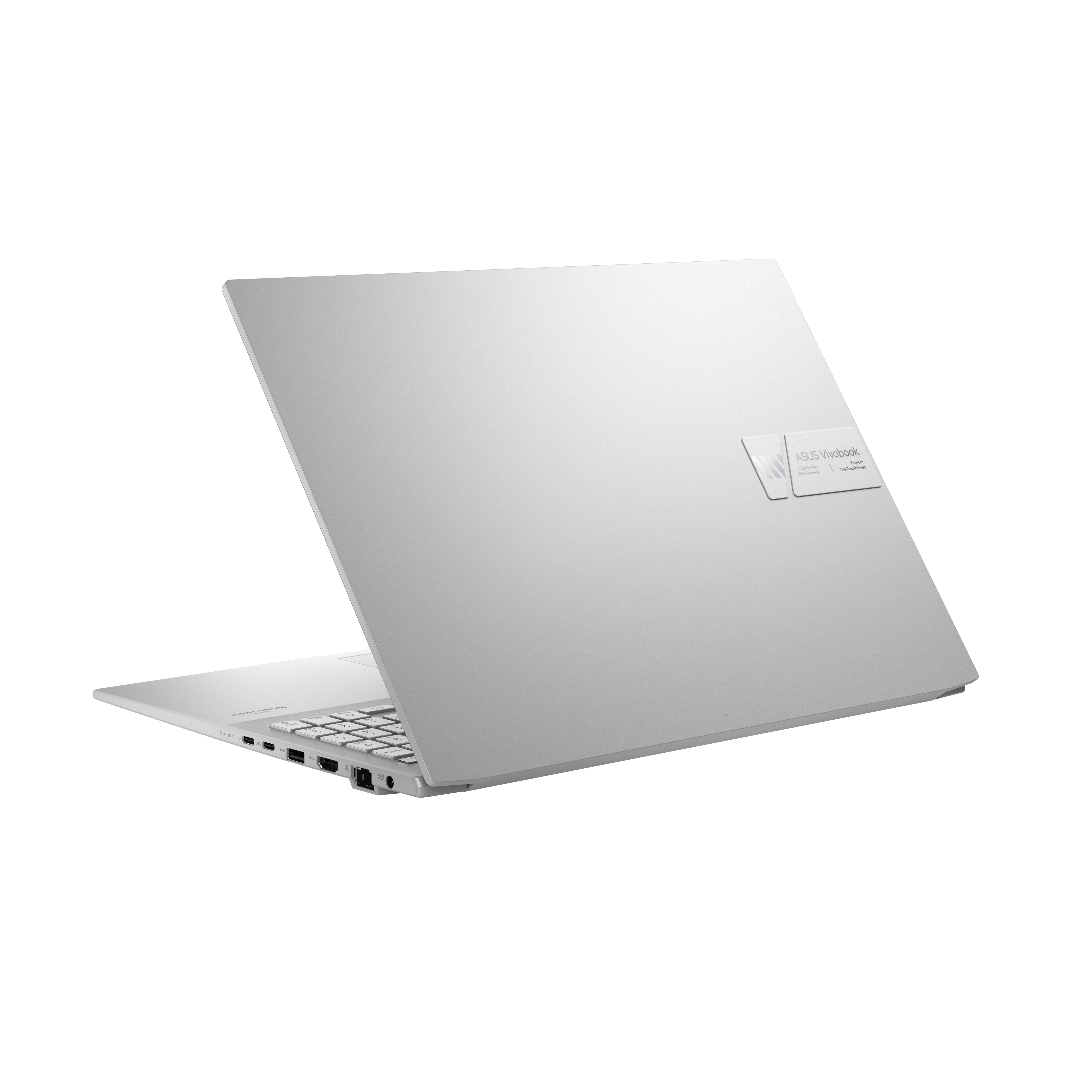 Laptop argentato aperto ad angolo. Il retro mostra il logo Asus Vivobook.