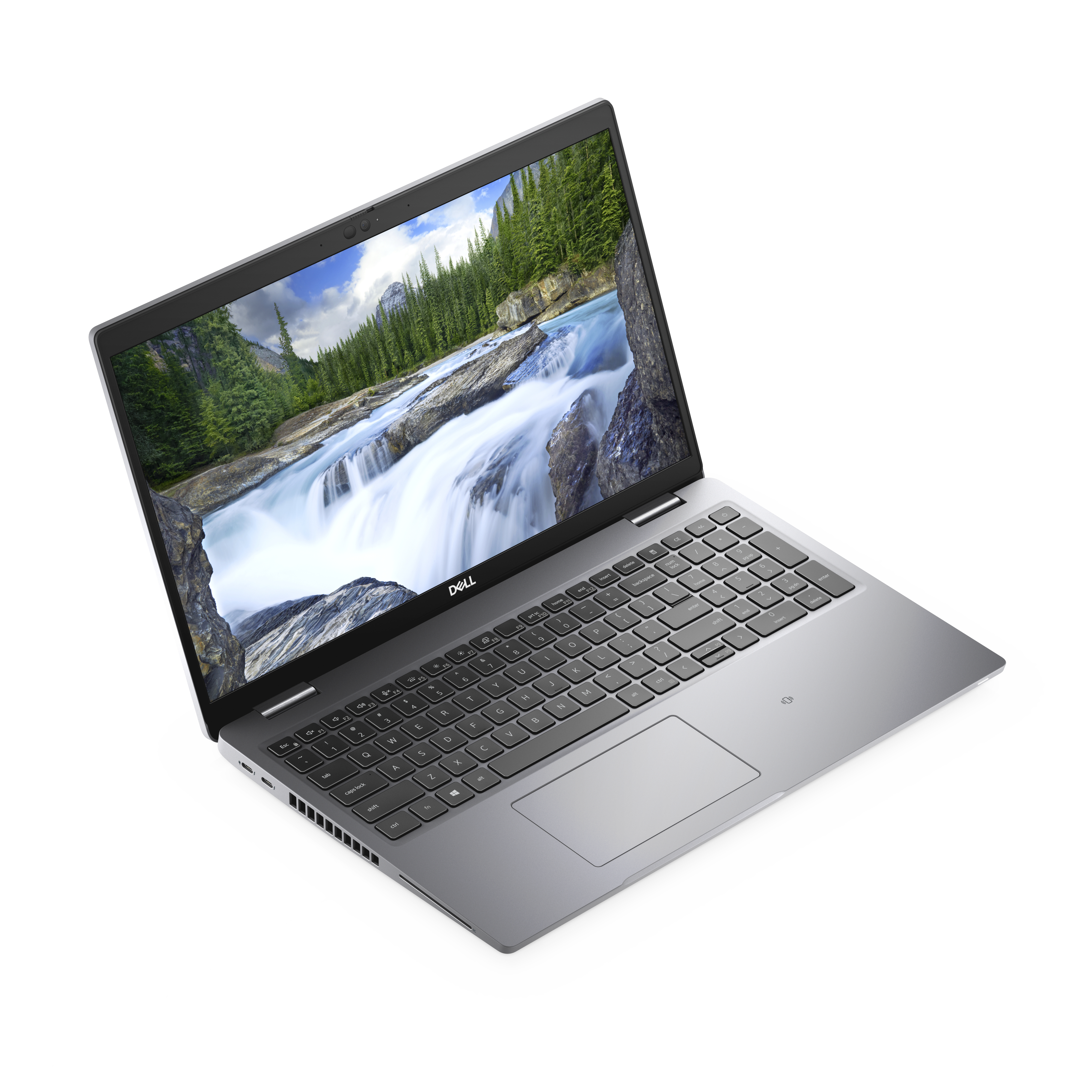 Un portátil plateado con una pantalla que muestra una escena de cascada. Tiene teclado y está sobre una superficie blanca.