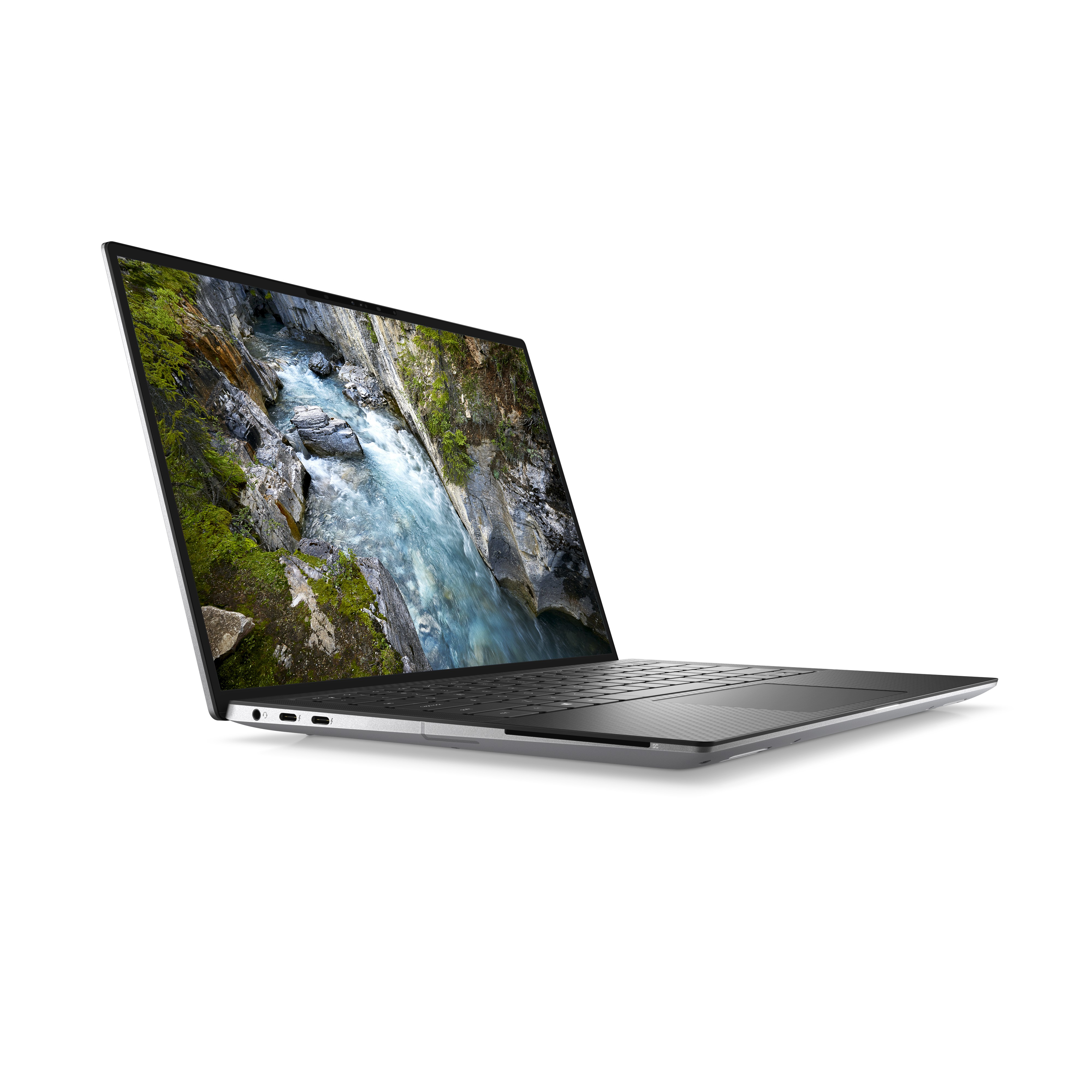 Portátil. Cuerpo plateado, teclado negro, pantalla muestra un río. Fondo blanco.