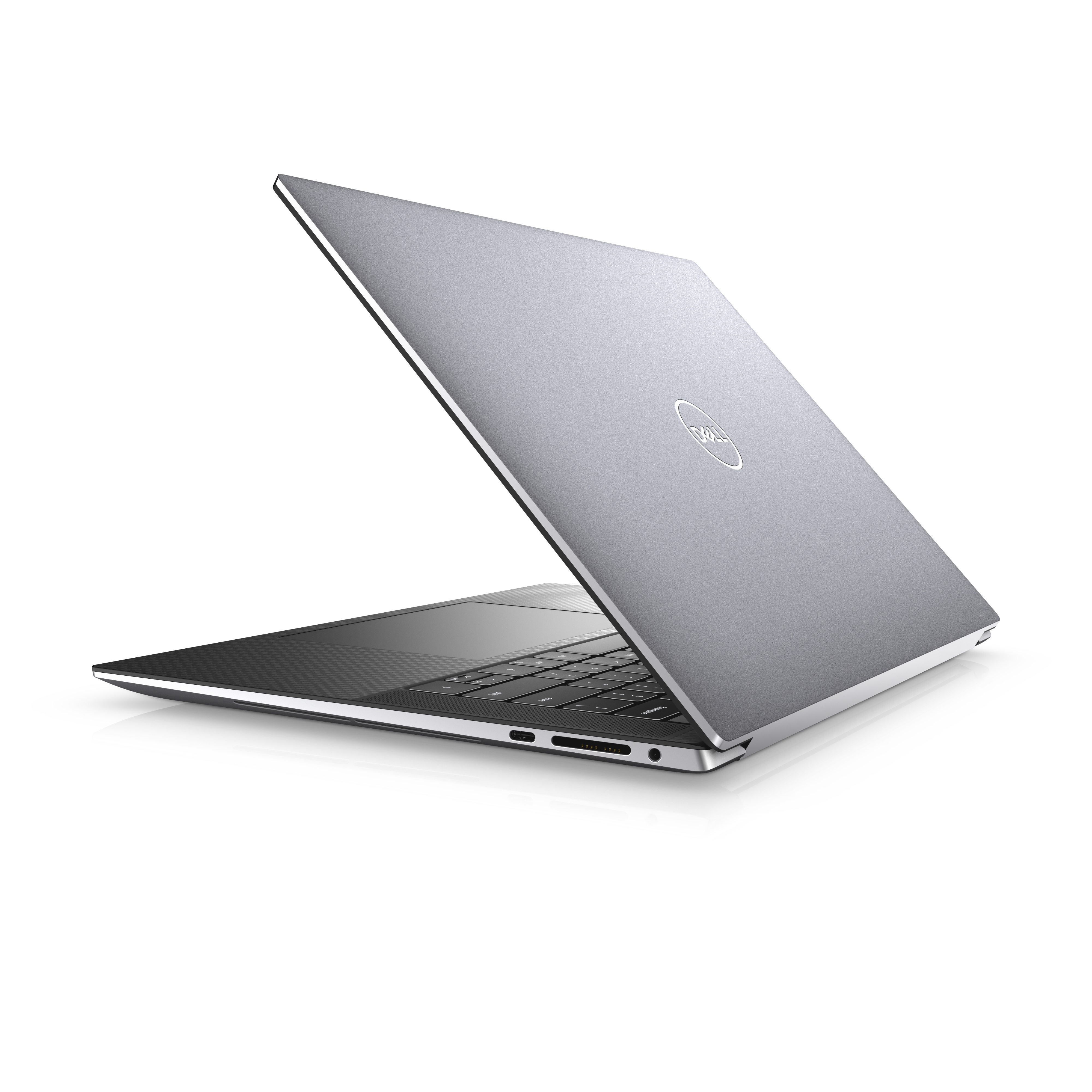 Laptop plateado, vista lateral, abierto, mostrando teclado y la parte trasera con el logo Dell.