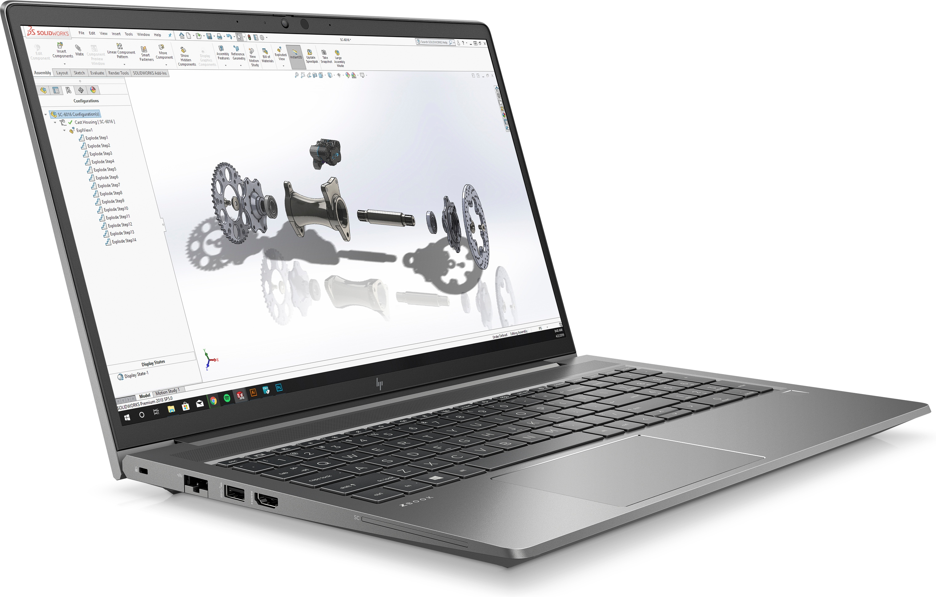 Laptop displaying a CAD program interface. The screen shows a complex 3D model.