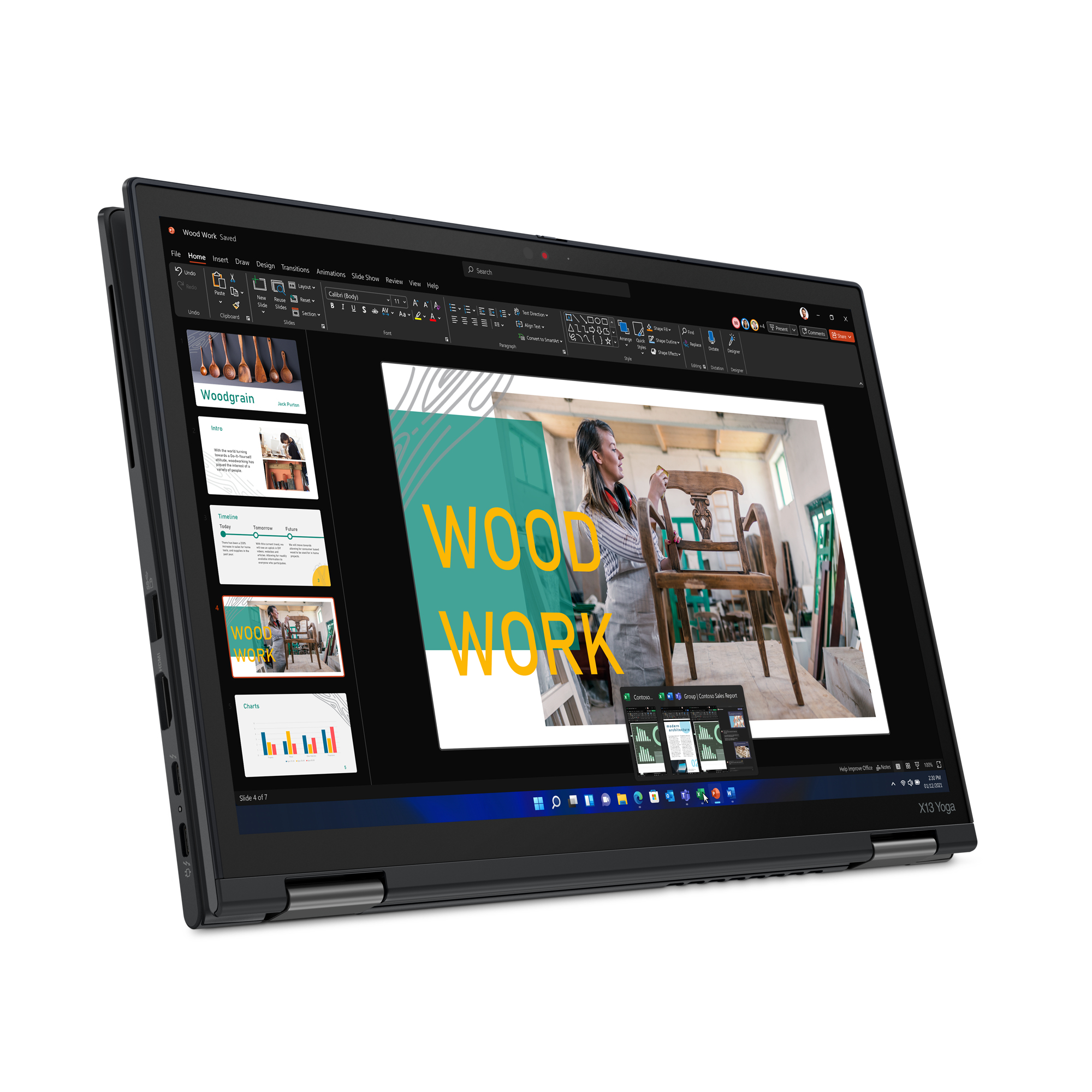 A laptop, open showing a slide presentation. The laptop is black and silver.