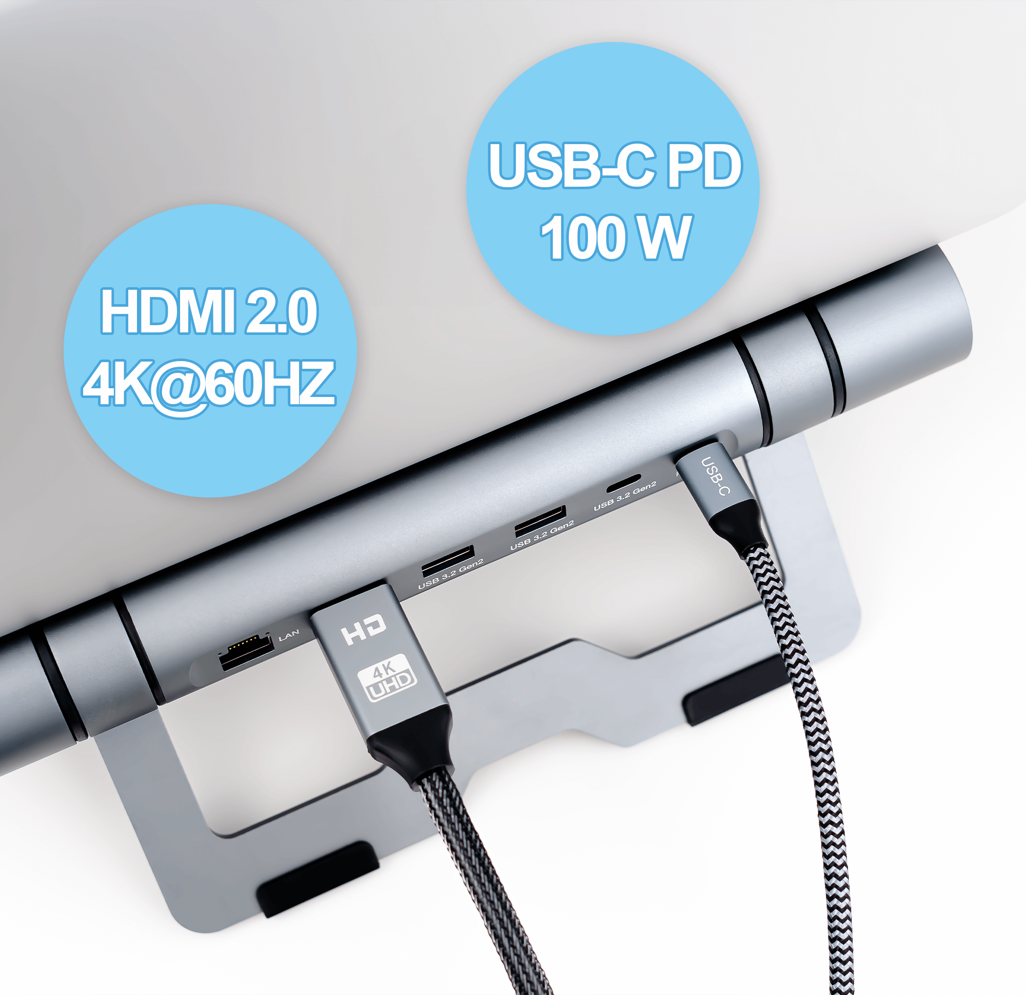 Stojak na laptopa z koncentratorem USB-C. Koncentrator ma porty i wyświetla etykiety HDMI 2.0 i USB-C PD 100W.