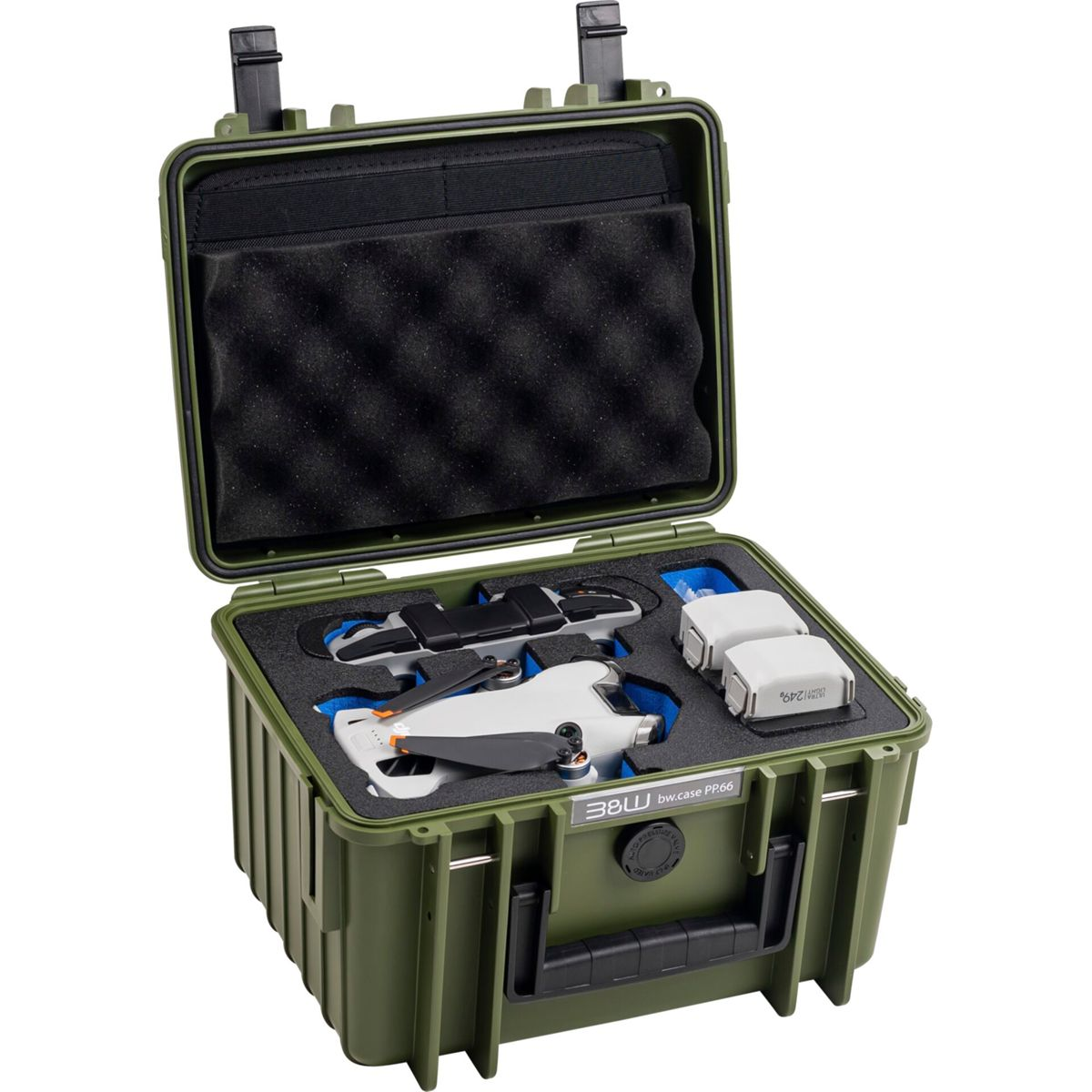 Custodia verde contenente un drone, batterie e accessori. Vista aperta.