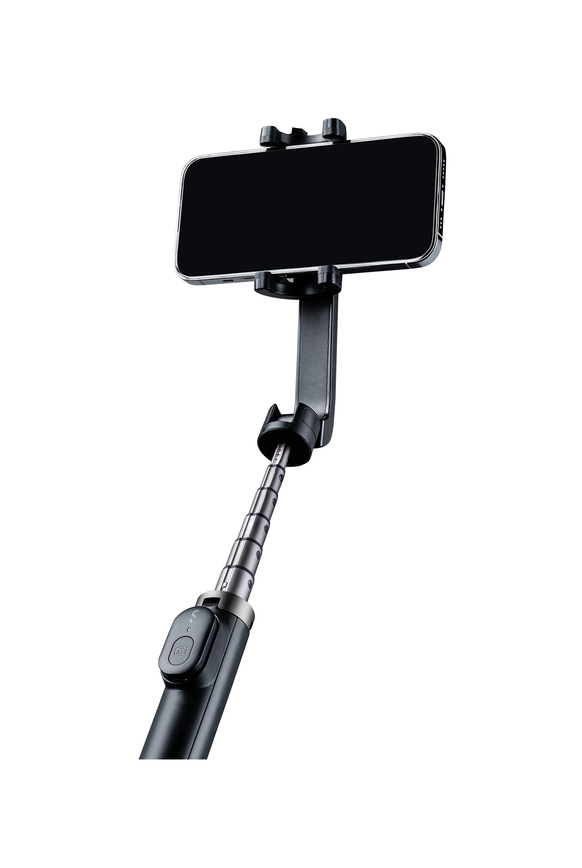 Czarny kij do selfie trzymający telefon. Telefon jest czarny, tło ciemne.