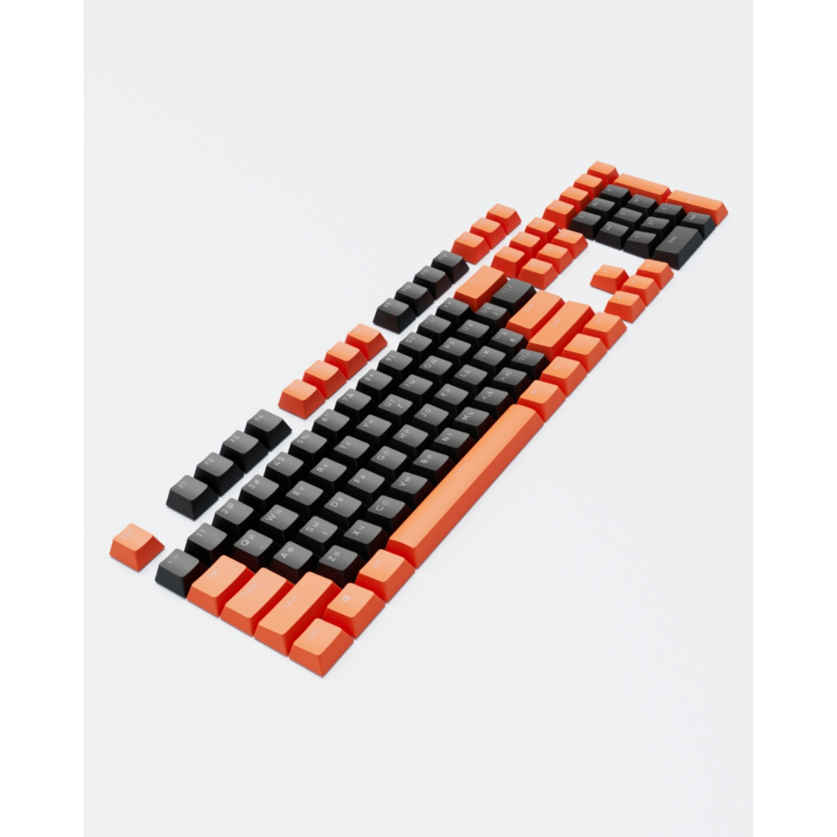 Orange und schwarze Tastaturtasten auf Weiß verstreut.