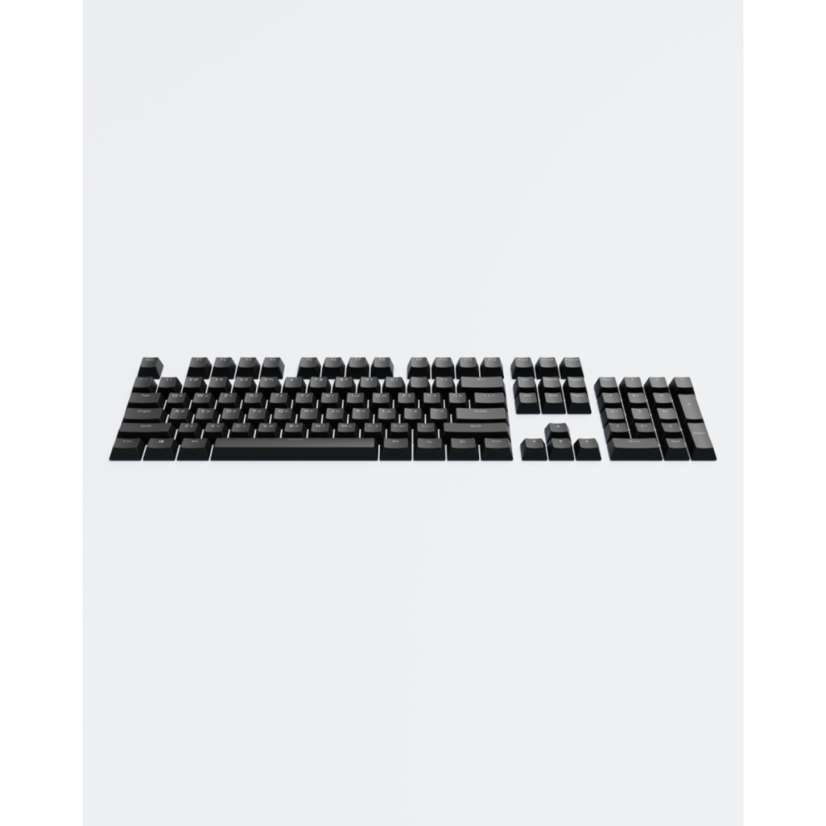Schwarze Tastaturtasten auf weißem Hintergrund.