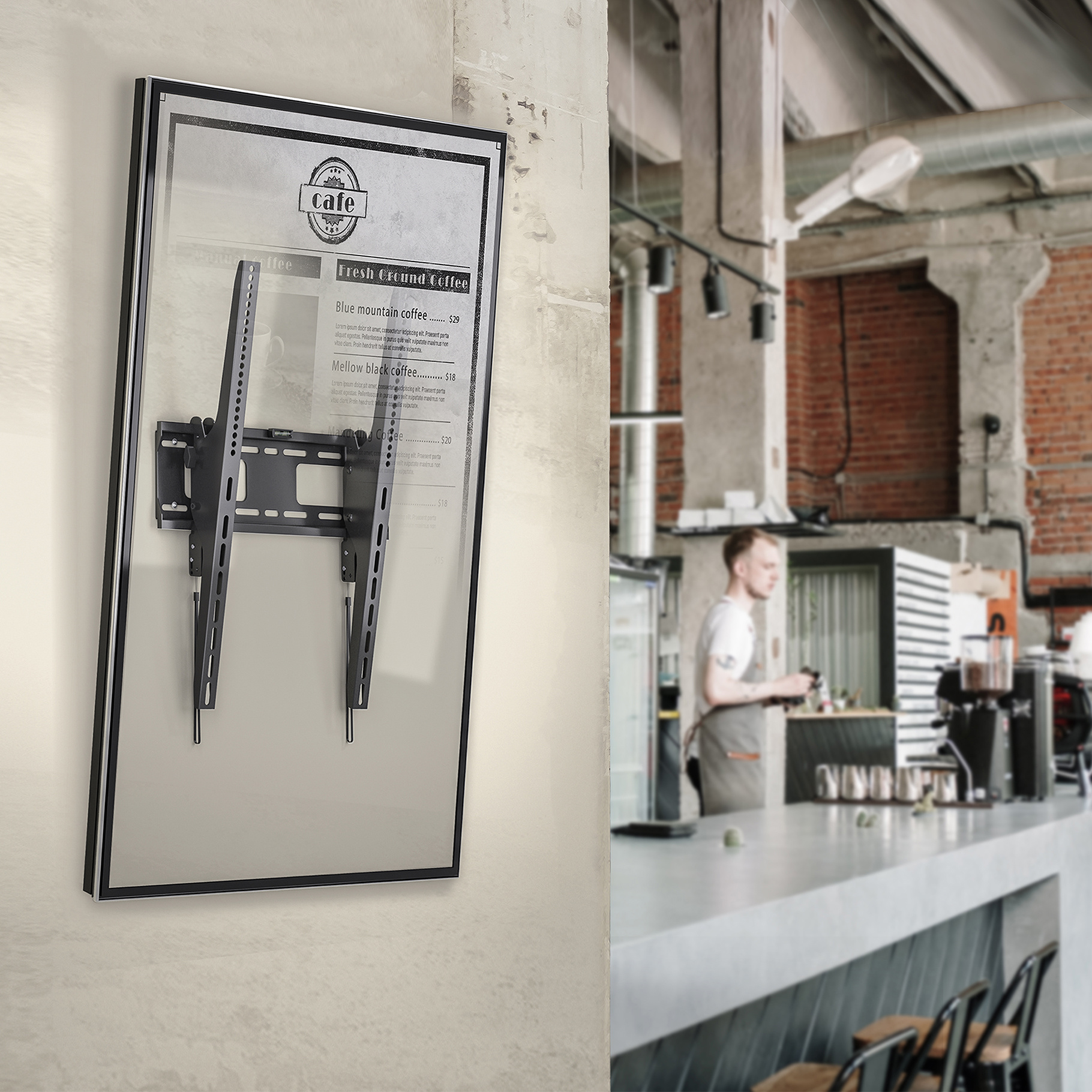 Menu board mounted on a wall, cafe in the background. A person is behind the counter.