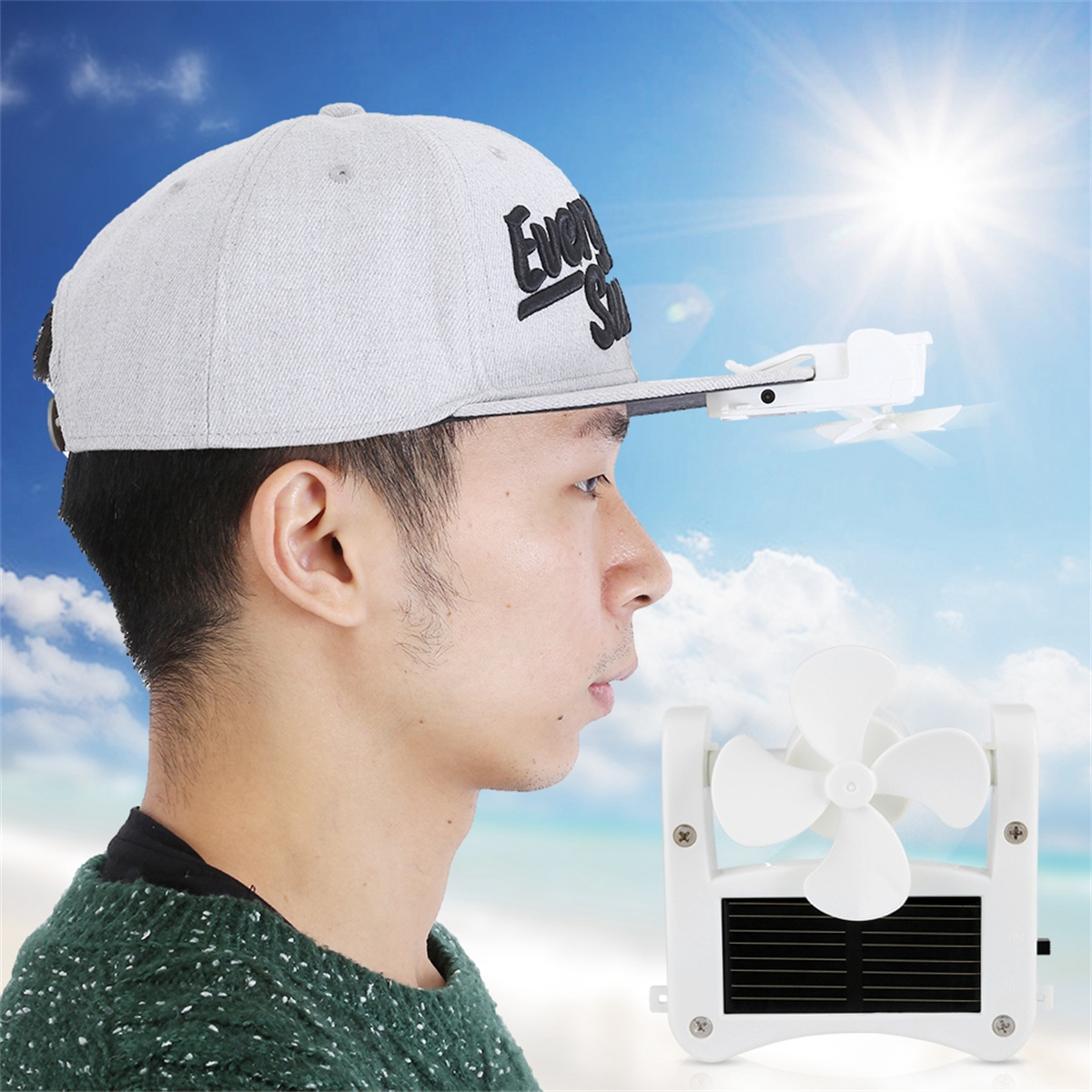 Ein Mann trägt eine graue Kappe mit einem kleinen weißen Ventilator am Schirm.