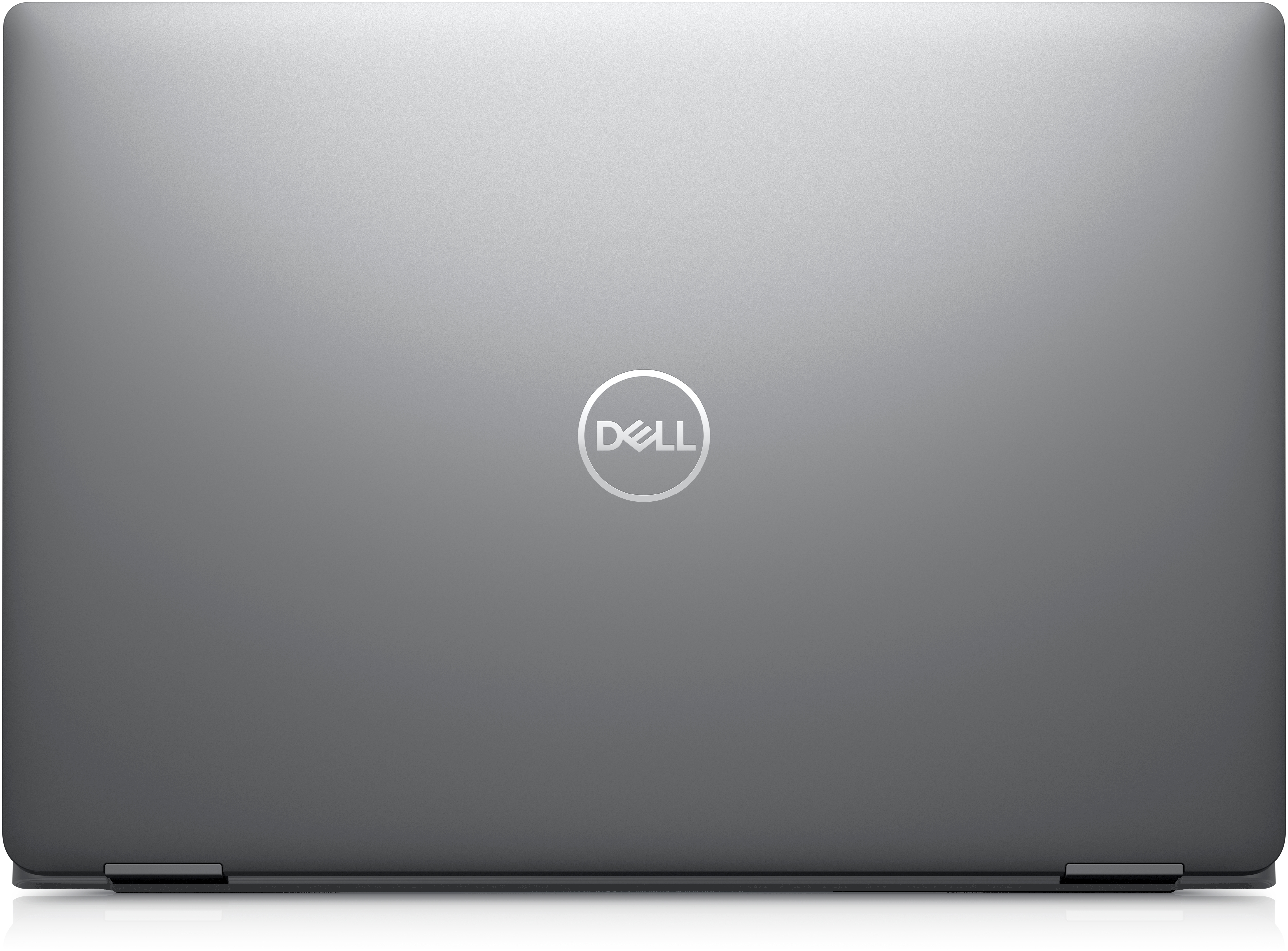 Laptop Dell chiuso con il logo Dell sulla cover grigia, su sfondo bianco.