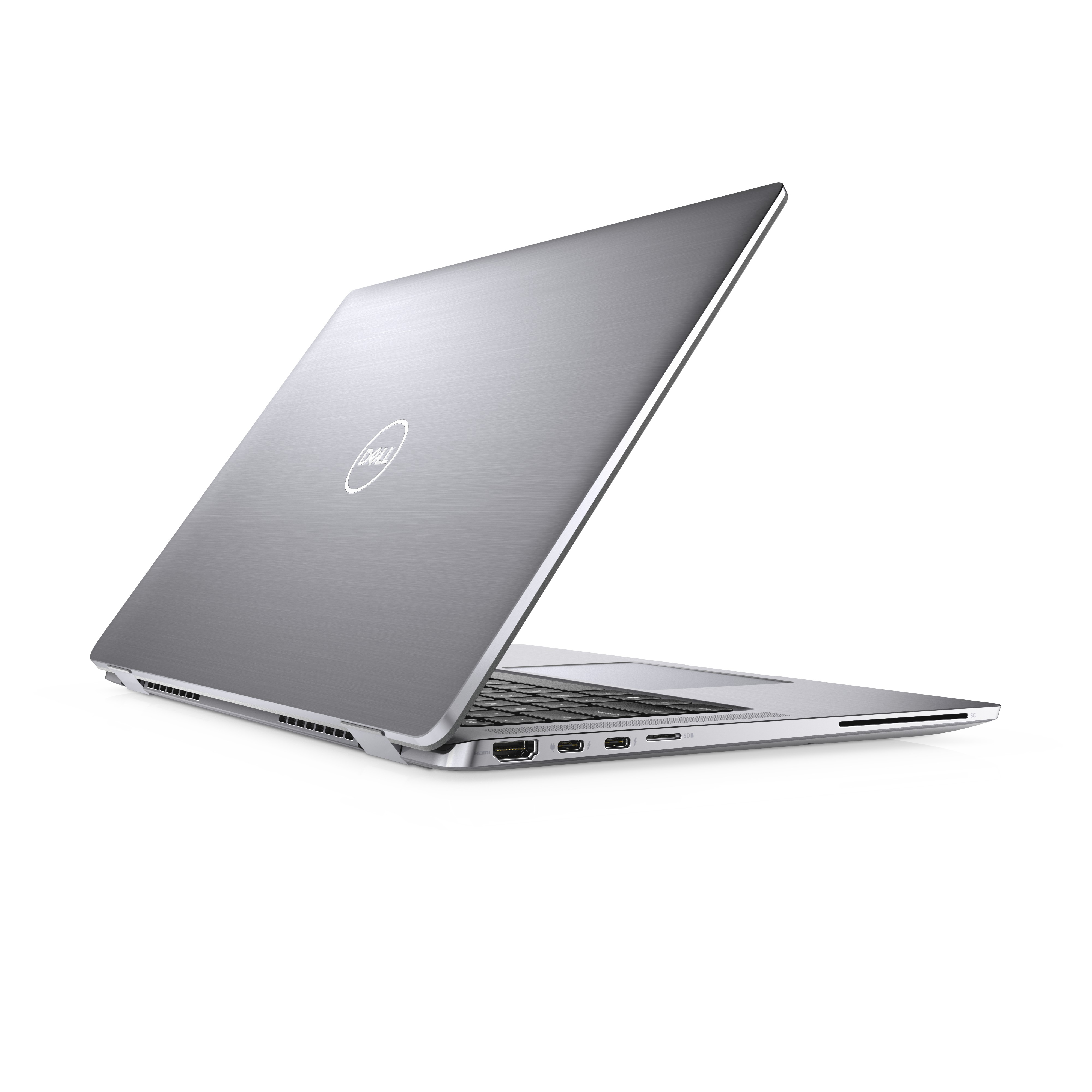Laptop Dell argentato aperto su superficie bianca. Logo Dell sul coperchio. Porte visibili.