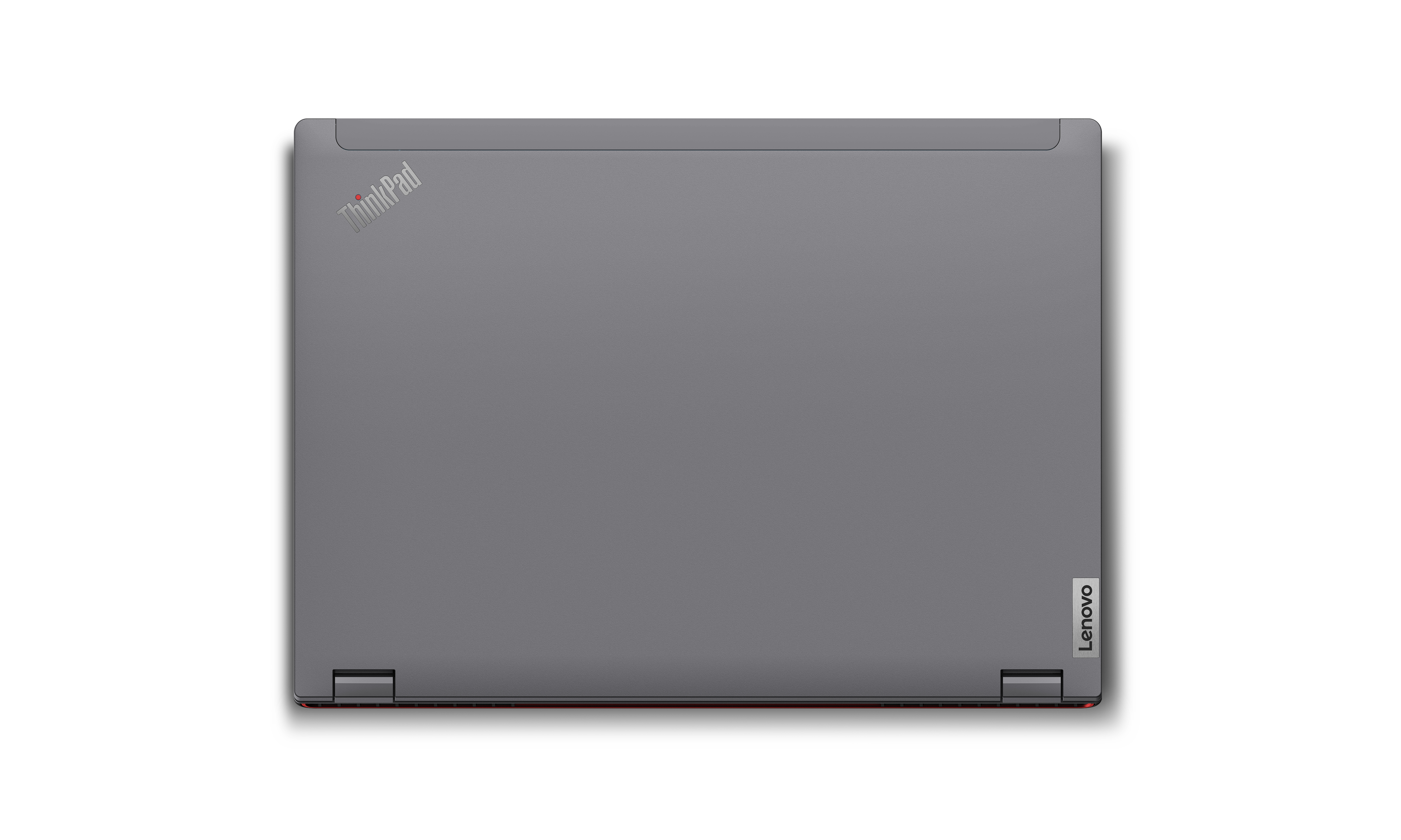 Laptop zamknięty od góry. Szara obudowa z logo ThinkPad i Lenovo. Białe tło.