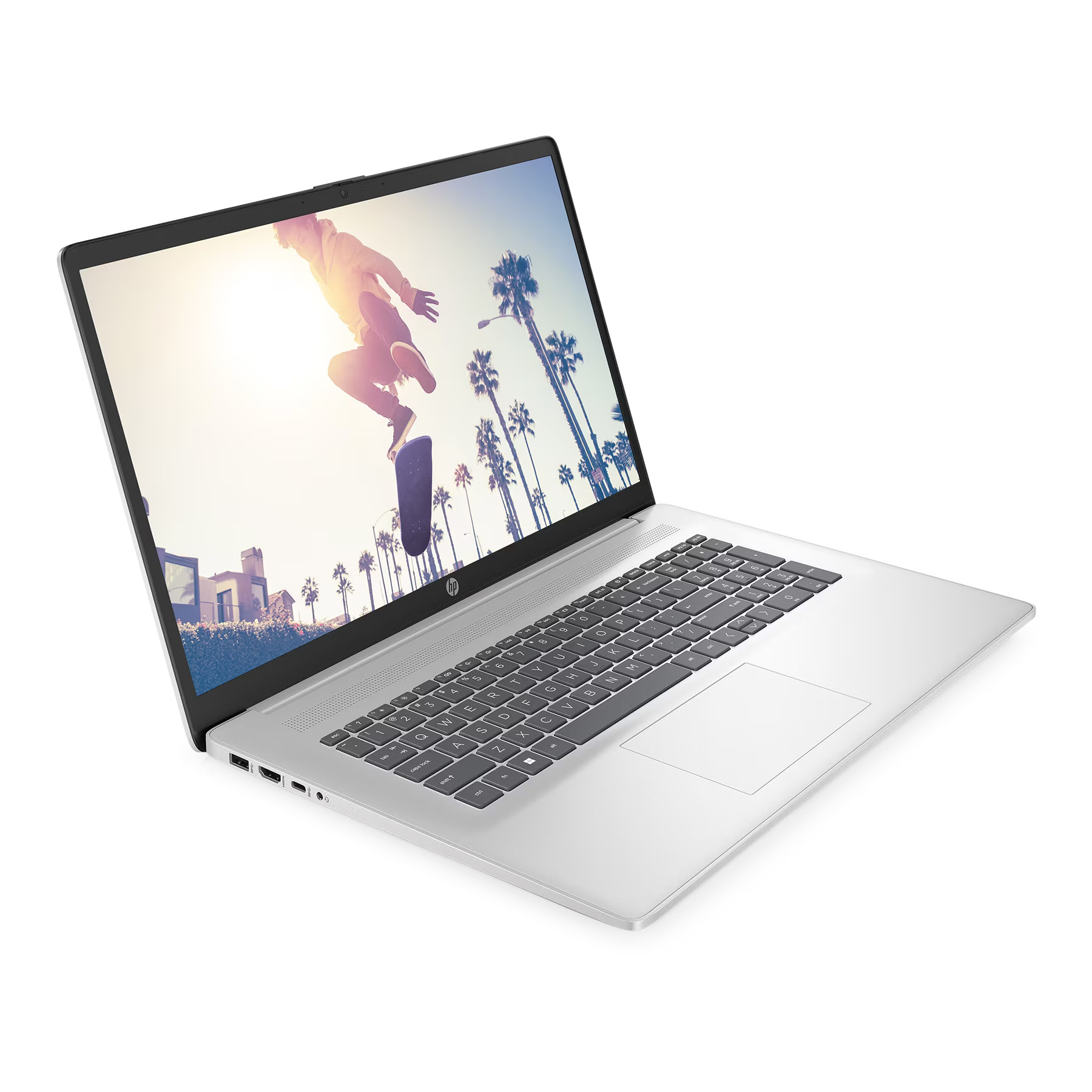 Silberner Laptop, der eine Person beim Skateboarden mit Palmen im Hintergrund zeigt.