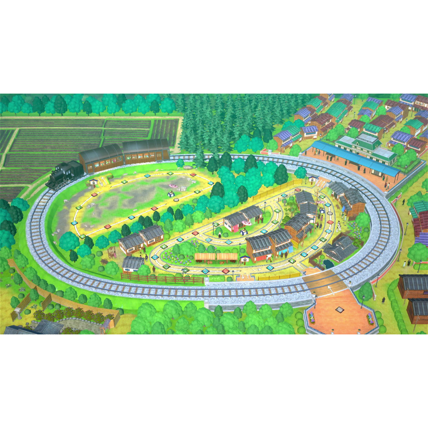 Un tabellone di gioco con una città e binari ferroviari, circondato da alberi e campi.