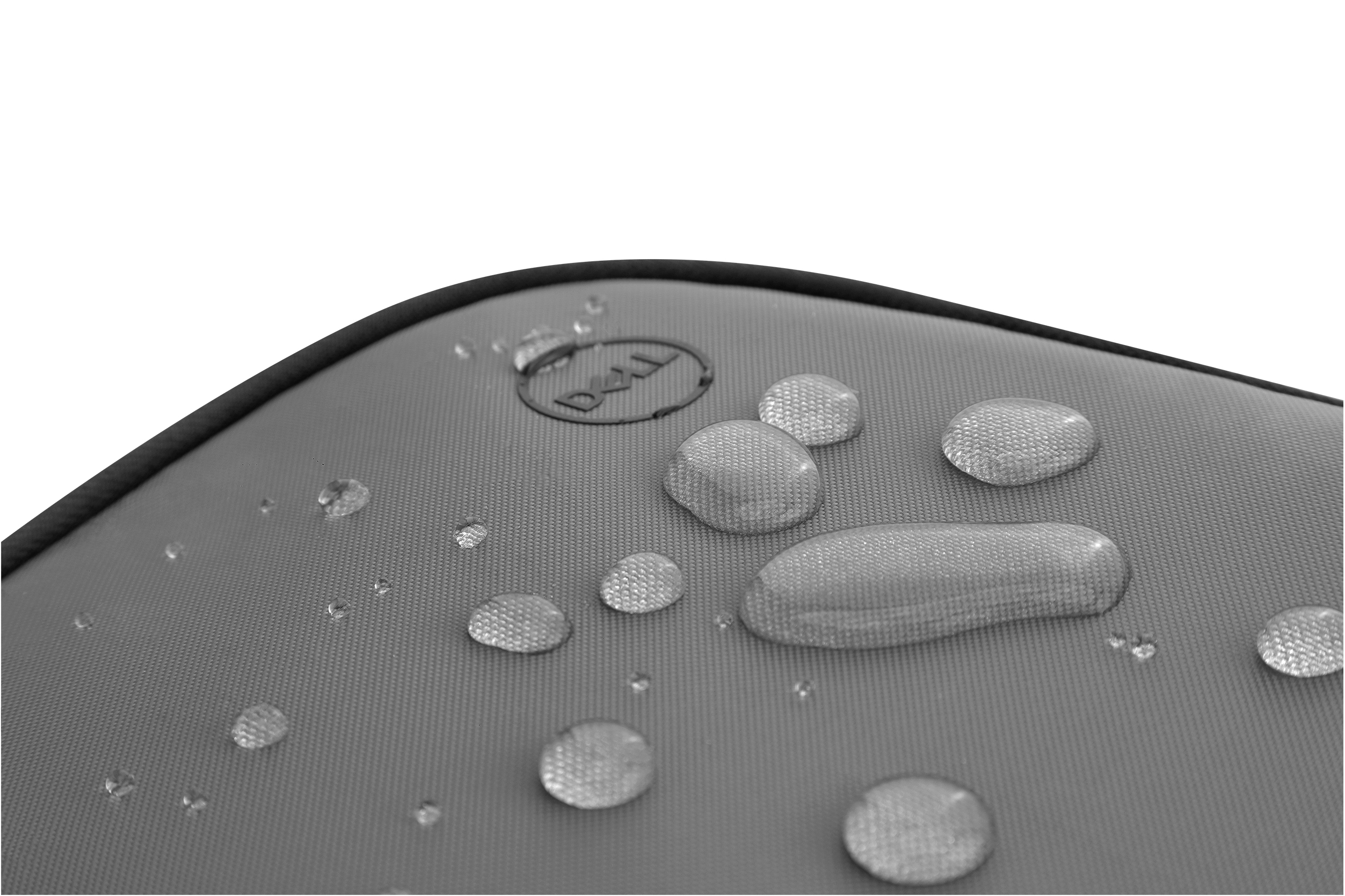 Close-up of a grey laptop case, with water droplets on it, on a white background.