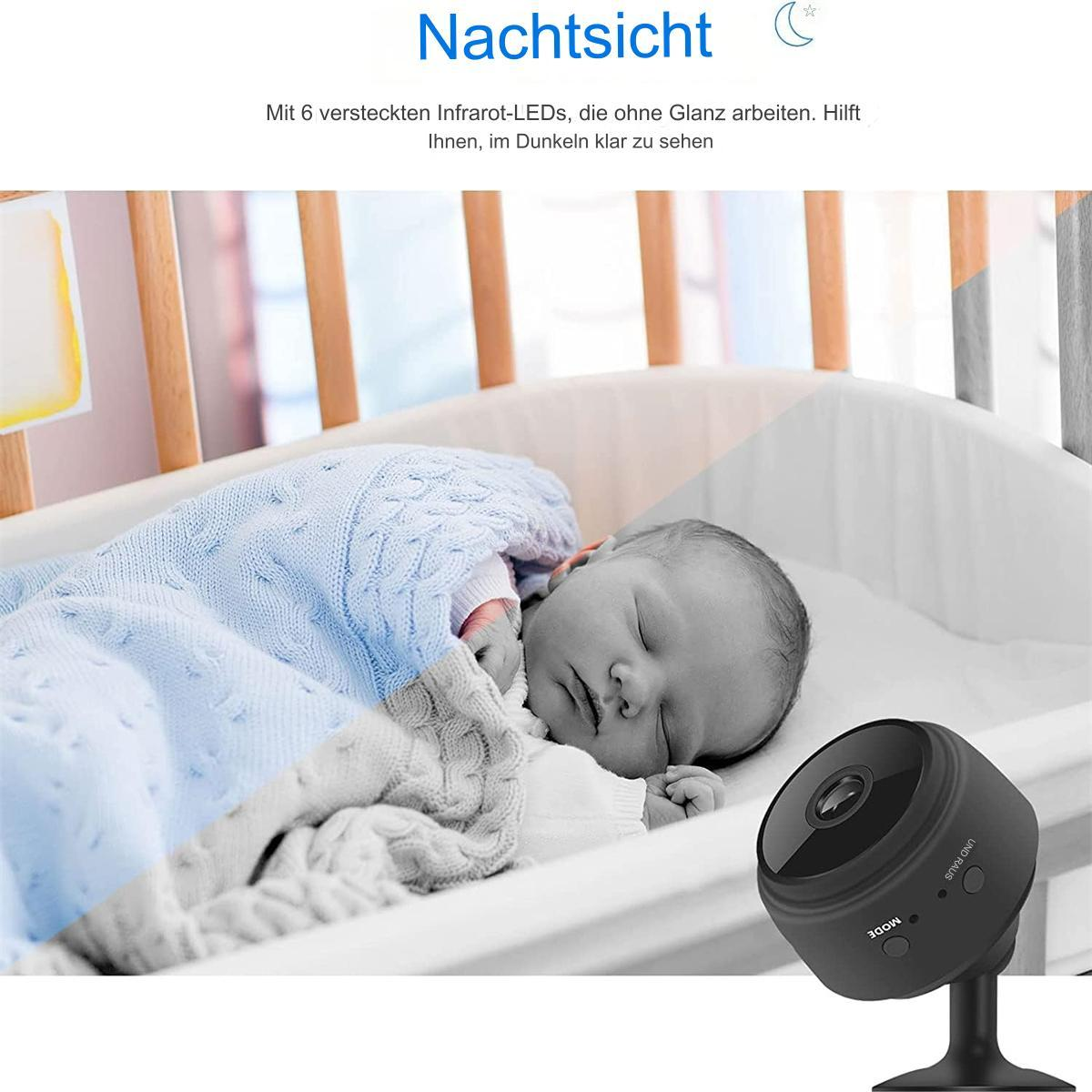 Ein Baby schläft in einem Kinderbett. Eine Nachtsichtkamera ist sichtbar.