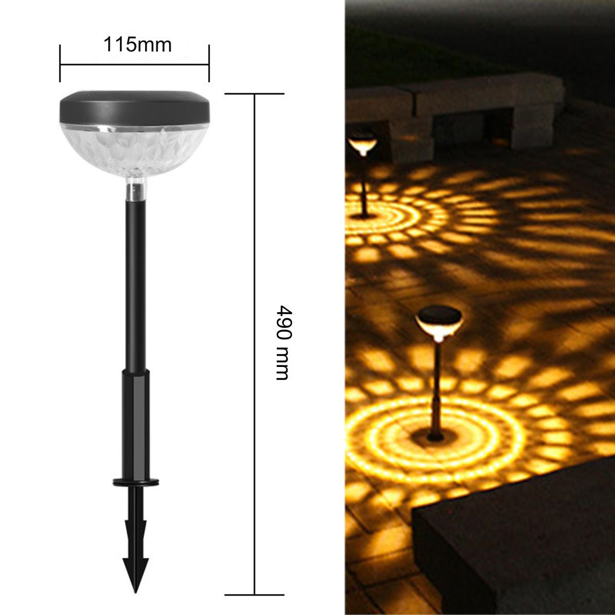 Solar-Gartenleuchte mit Maßen. Zwei Lichter sind an. Die Lichter werfen ein kreisförmiges Muster auf den Boden.