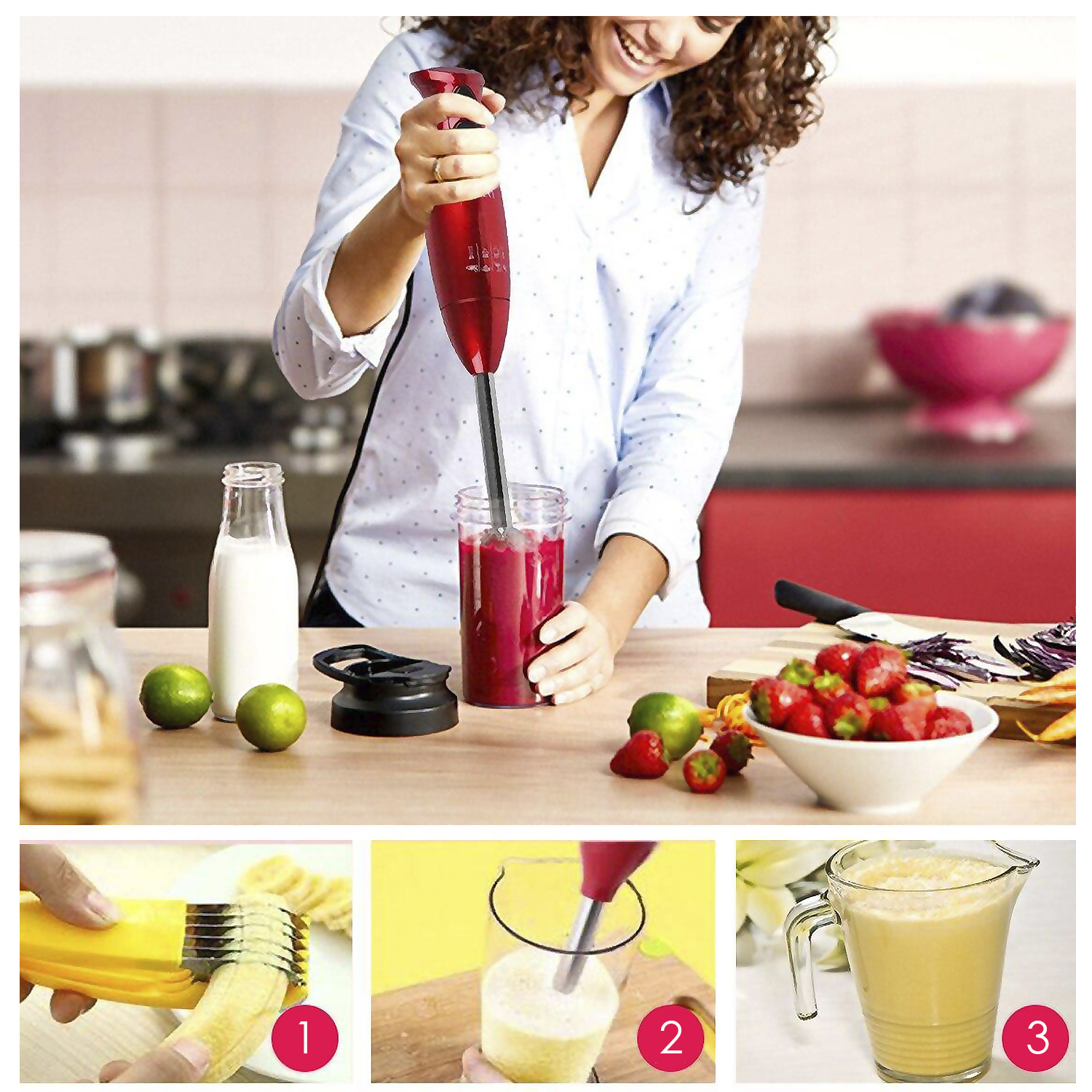 Una donna usa un frullatore a immersione rosso per fare un frullato. Lime, fragole e latte sono sul tavolo.