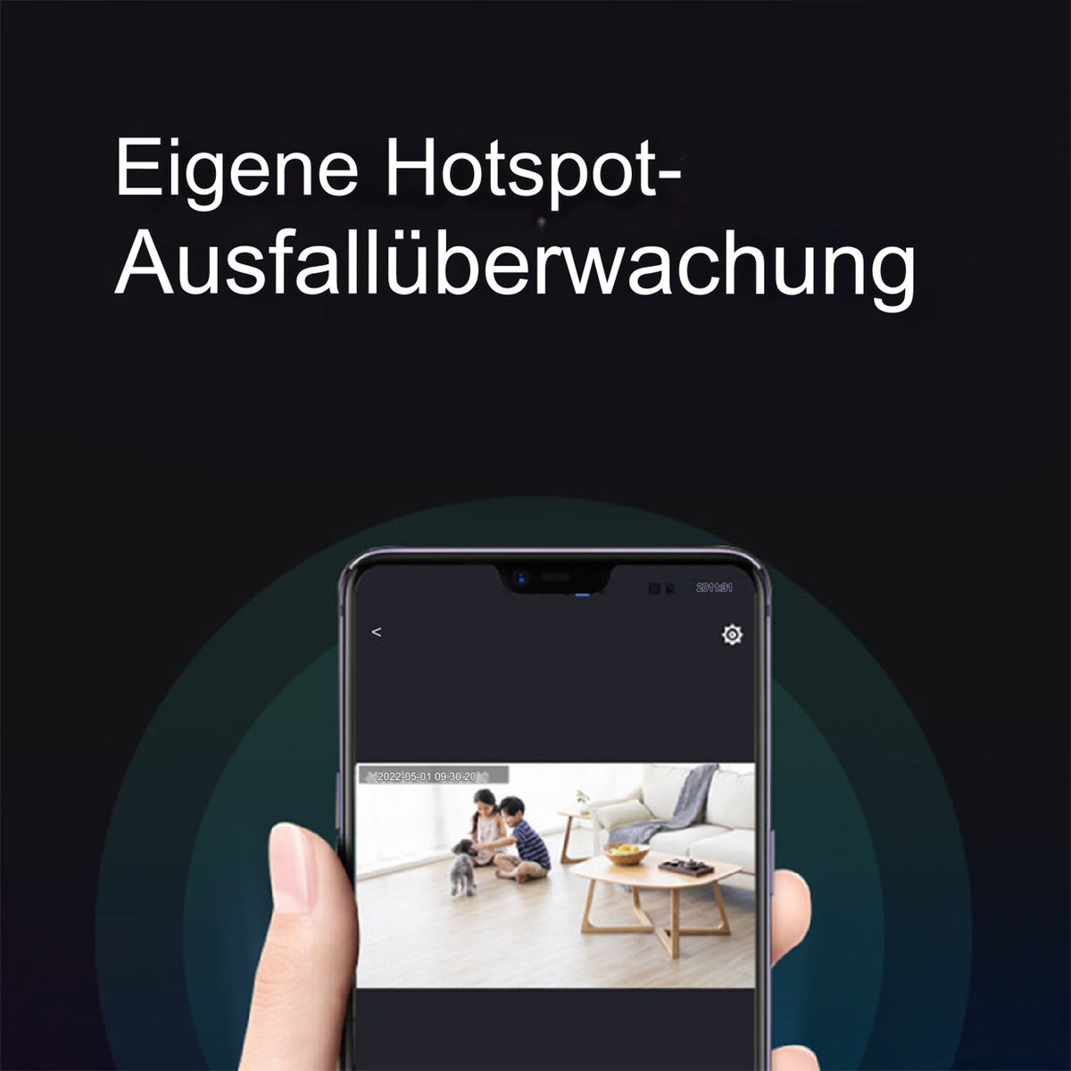 Ein Telefon zeigt einen Video-Feed von zwei Personen und einem Hund in einem Wohnzimmer.