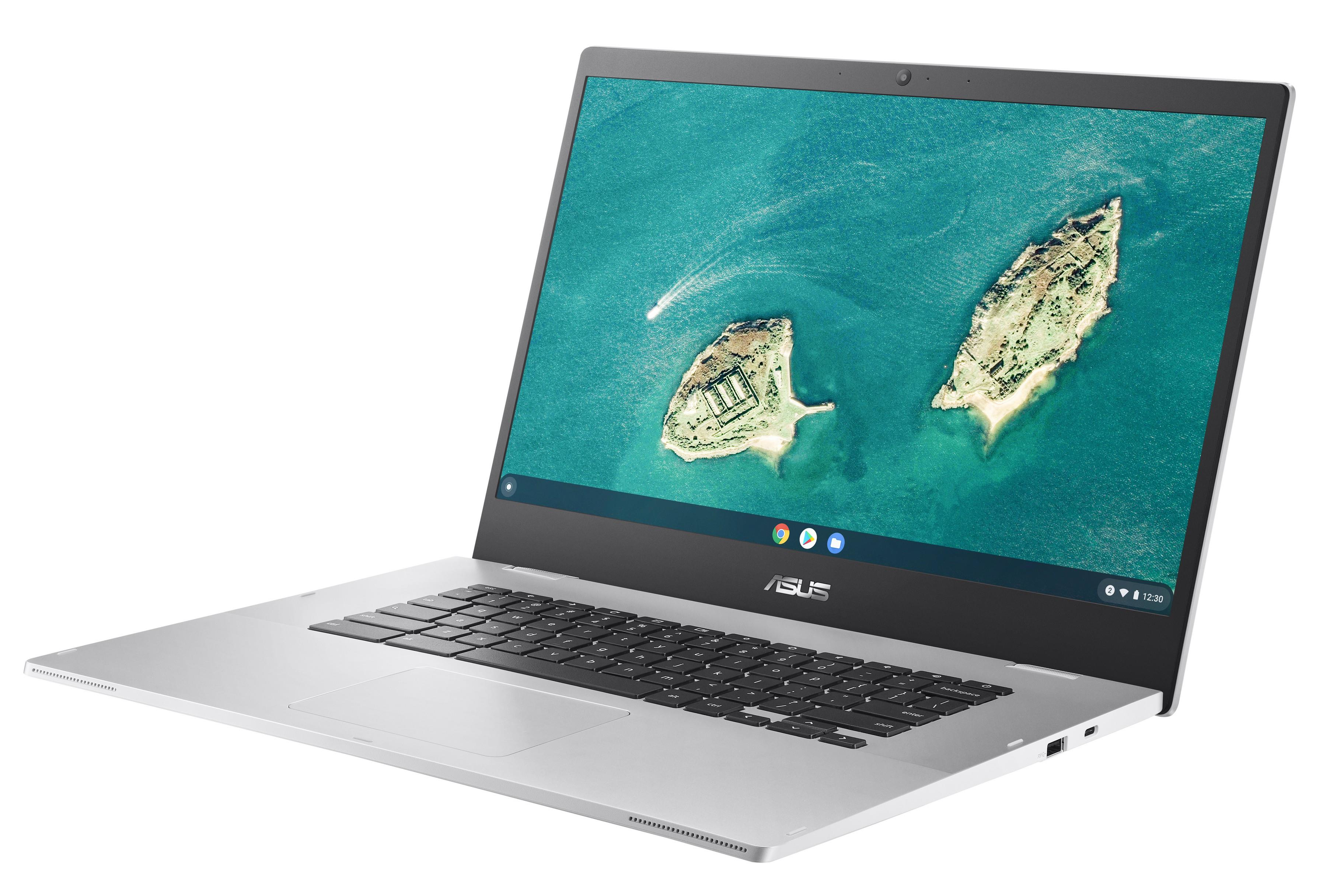 Laptop argento aperto, mostra un'isola nell'oceano. Tastiera nera.