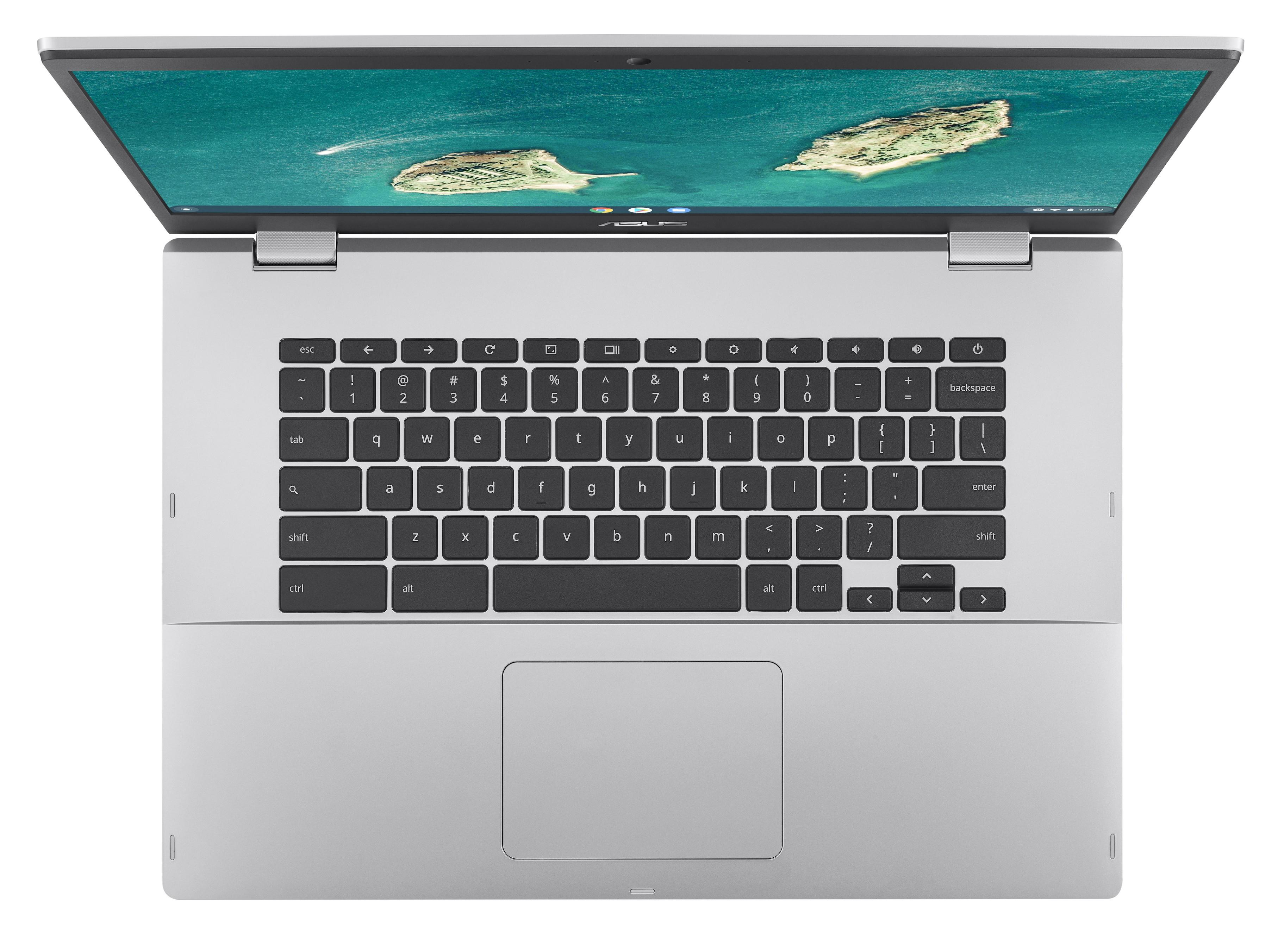 Laptop argentato aperto, vista dall'alto, con tastiera e schermo che mostra un paesaggio.