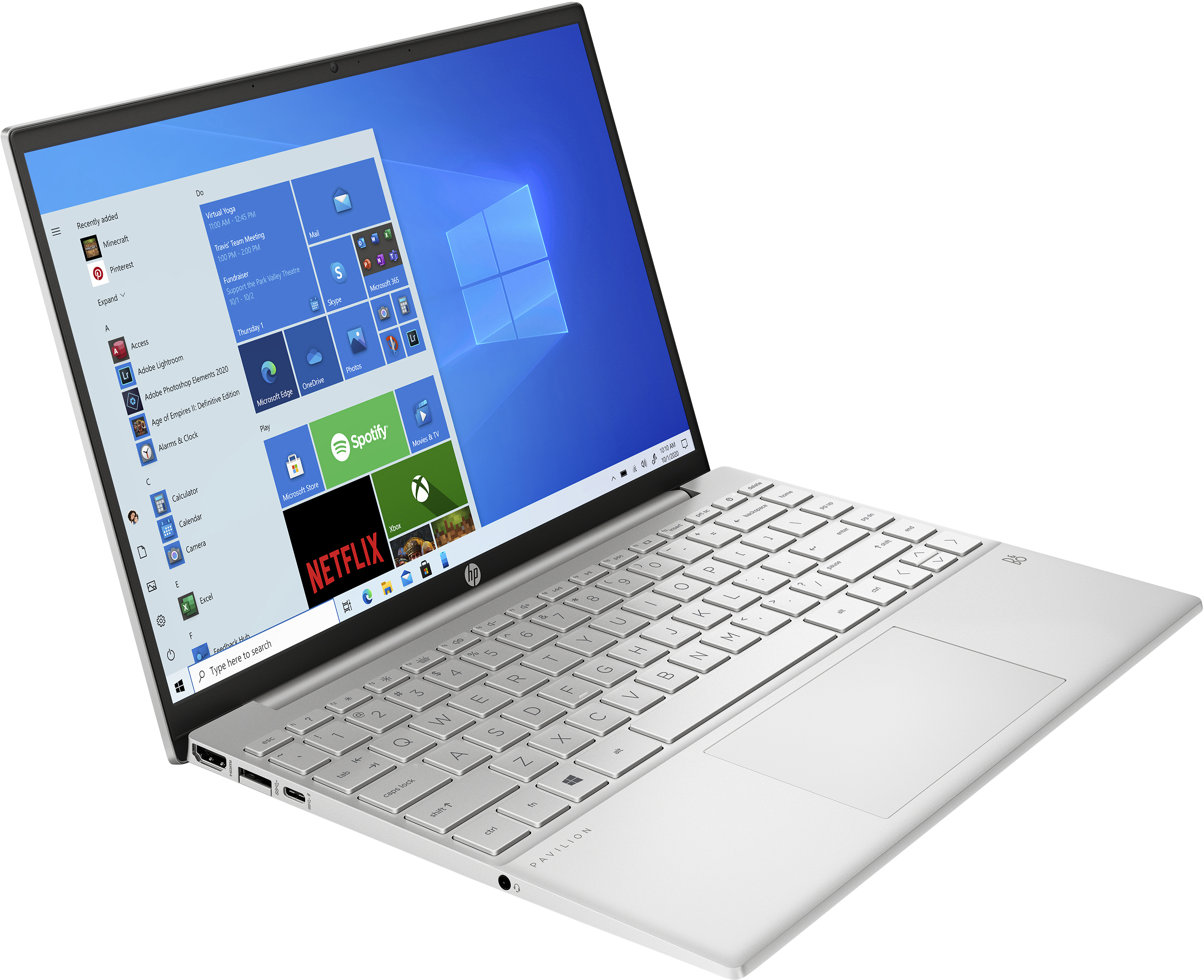 Laptop HP Pavilion argentato con desktop Windows 10, che mostra varie icone di app.