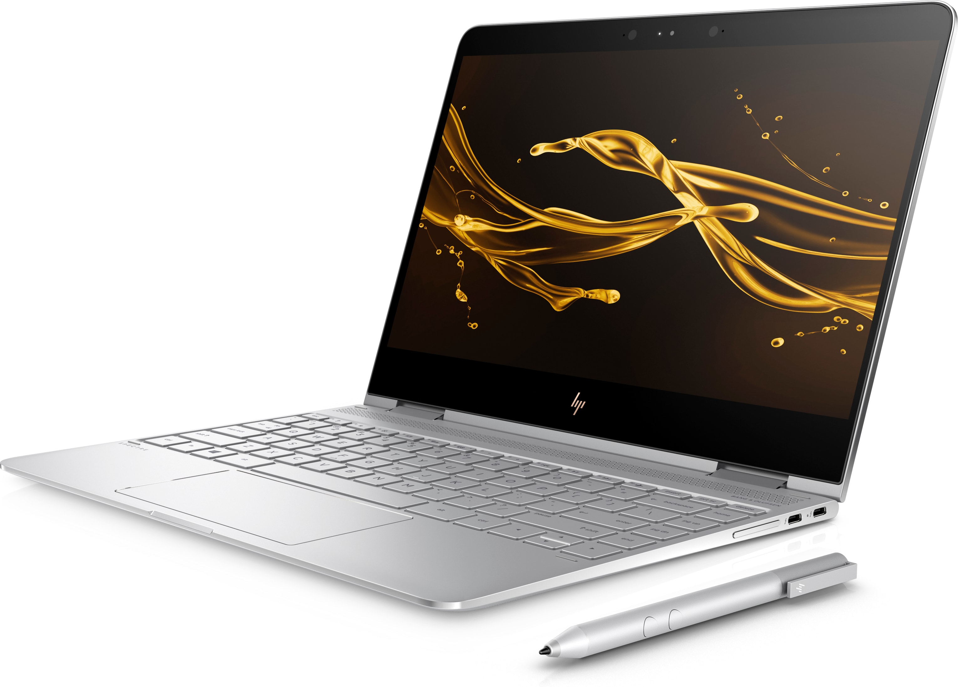 Laptop argentato con spruzzo dorato sullo schermo. Penna stilo a destra.
