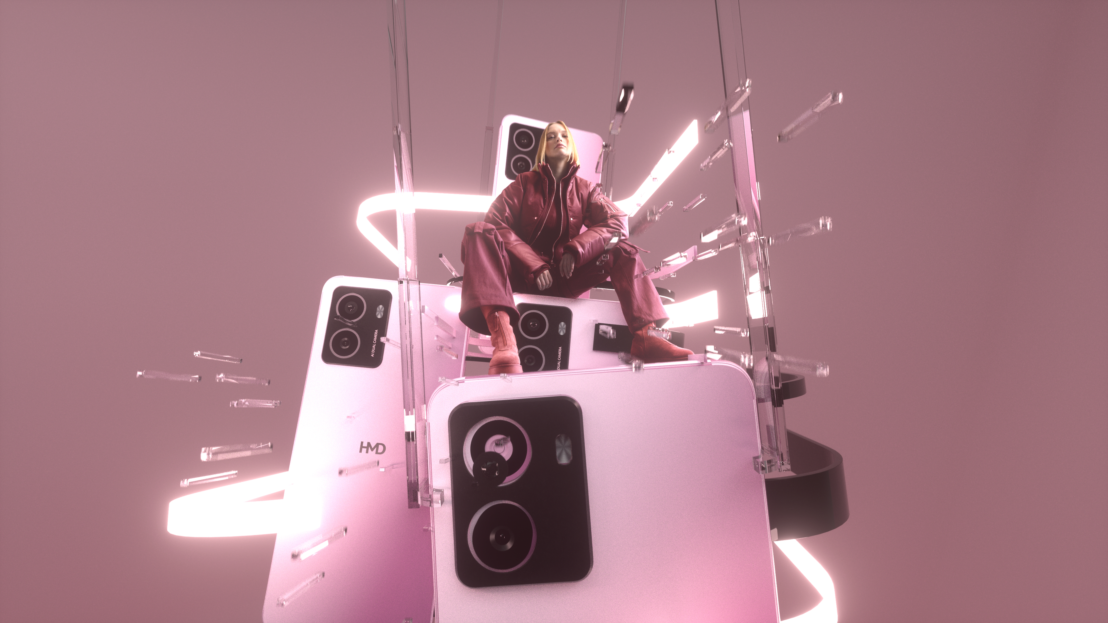 Model siedzący na strukturze telefonów. Scena skąpana jest w różowym świetle.