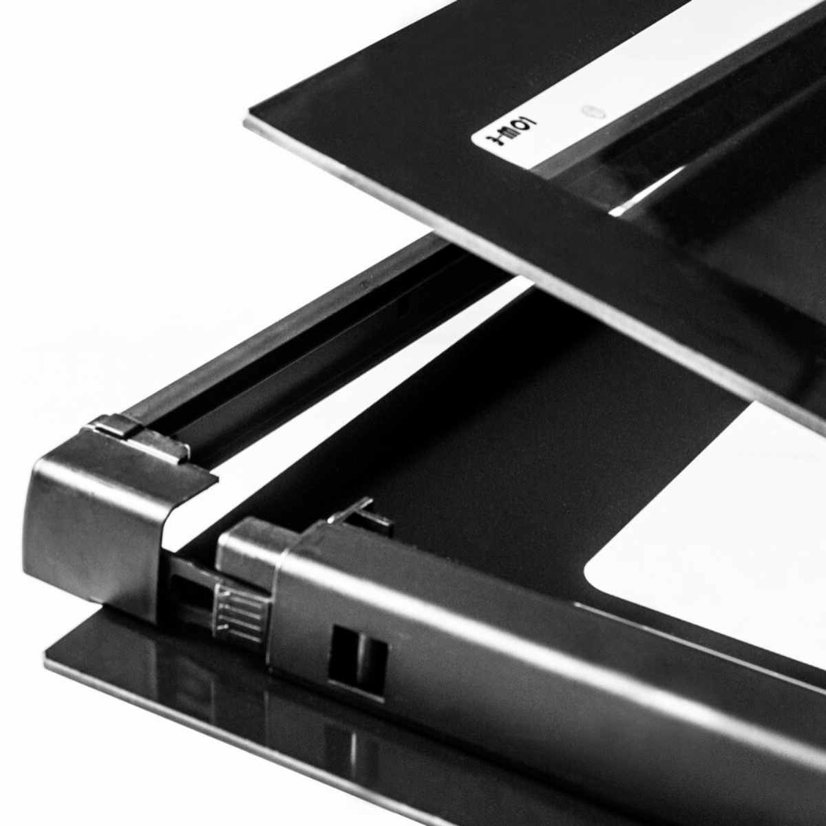 Oven door, black frame and metal supports, with a sticker: HM01.