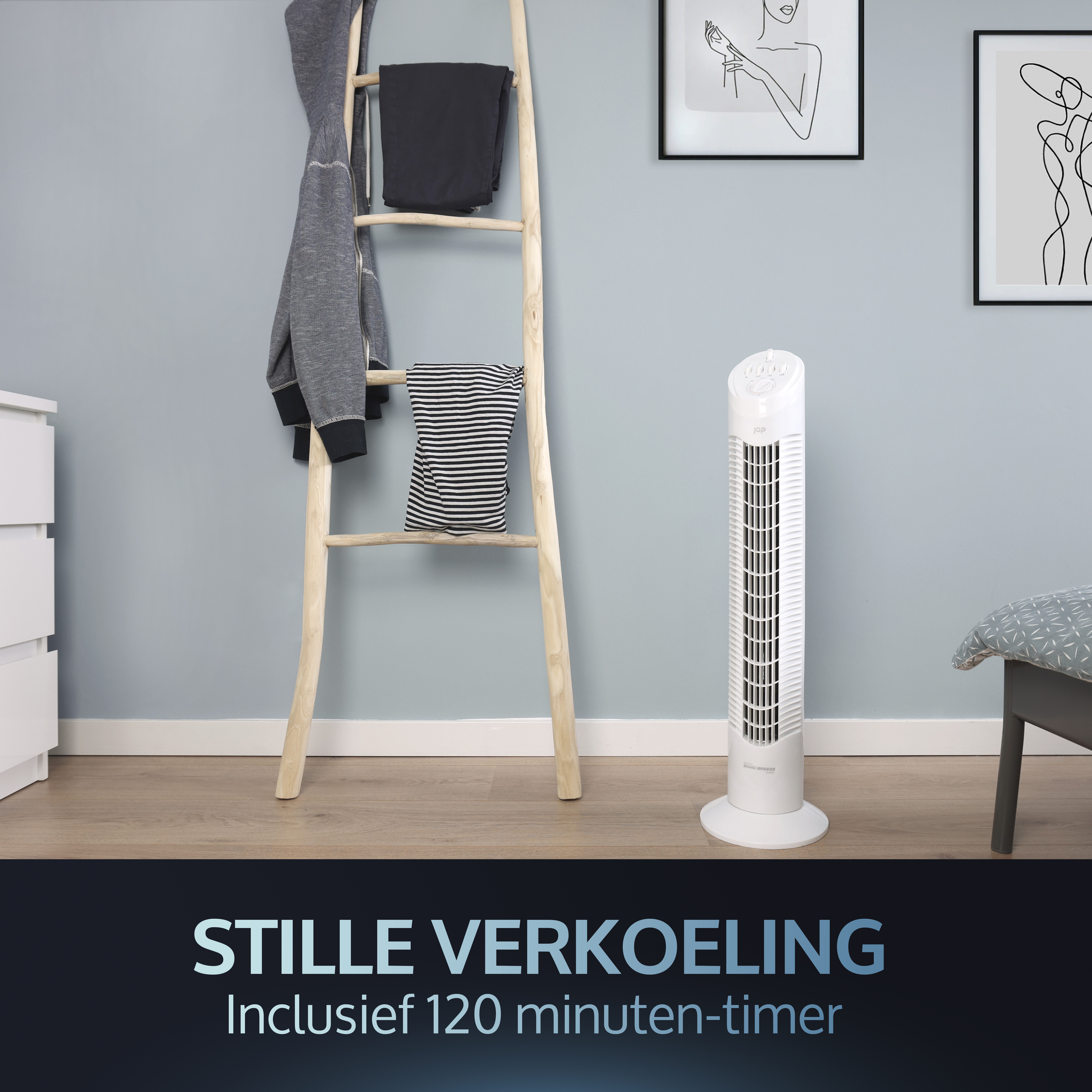 A white tower fan next to a wooden ladder with clothes.