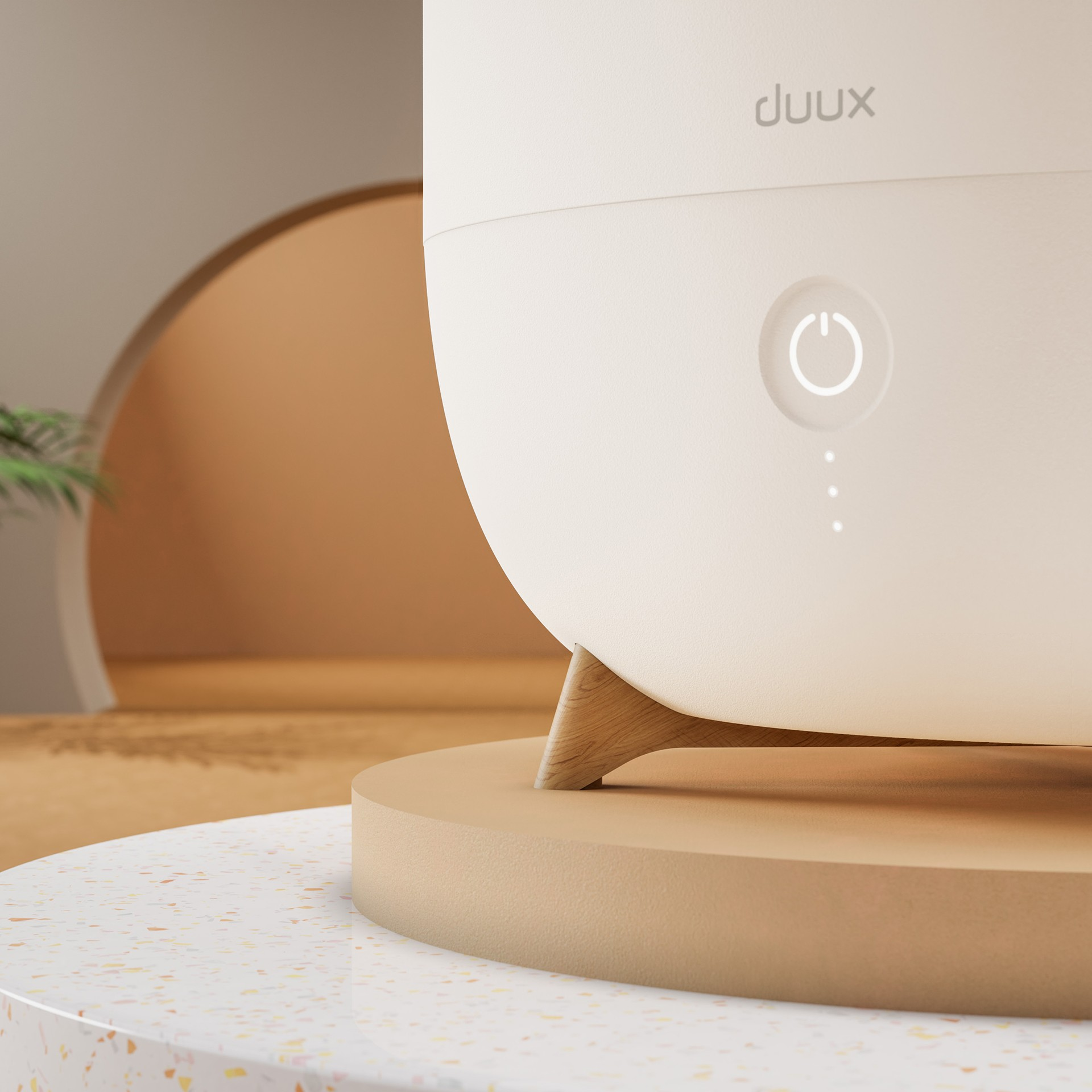 Crèmekleurige diffuser met aan/uit-knop en lampjes op een beige oppervlak.