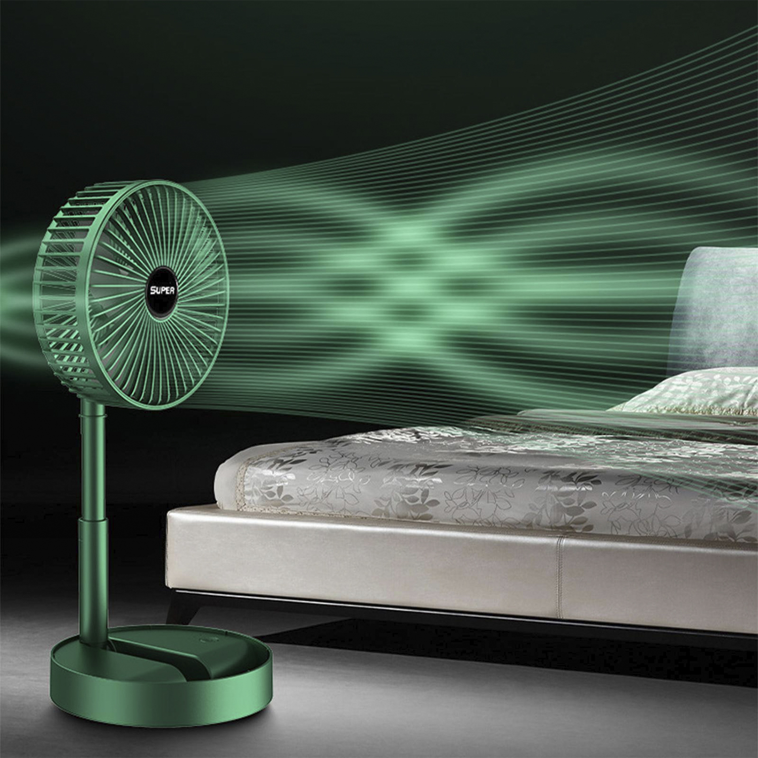 Un ventilatore verde soffia aria. Un letto è sullo sfondo.
