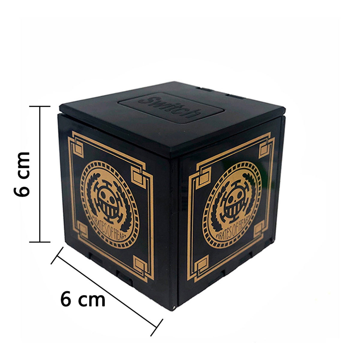 Ein schwarzer Würfel mit goldenen Designs und Text, der Switch lautet. Die Box ist 6 cm groß.