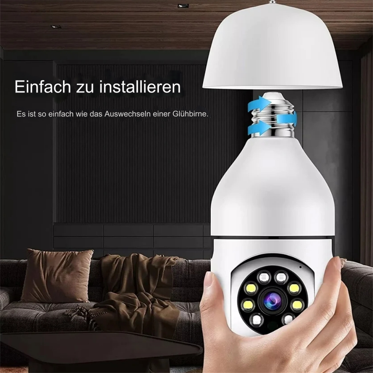 Hand installiert eine Glühbirnenkamera in eine Fassung.