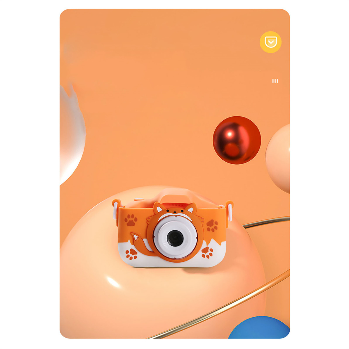 Eine orangefarbene Kinderkamera mit Pfotenabdrücken, auf einem orangefarbenen und blauen Hintergrund.